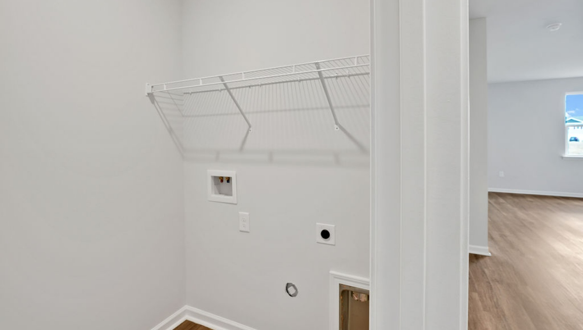 At the back, the Primary Suite provides privacy with a large walk-in closet and walk-in shower.
