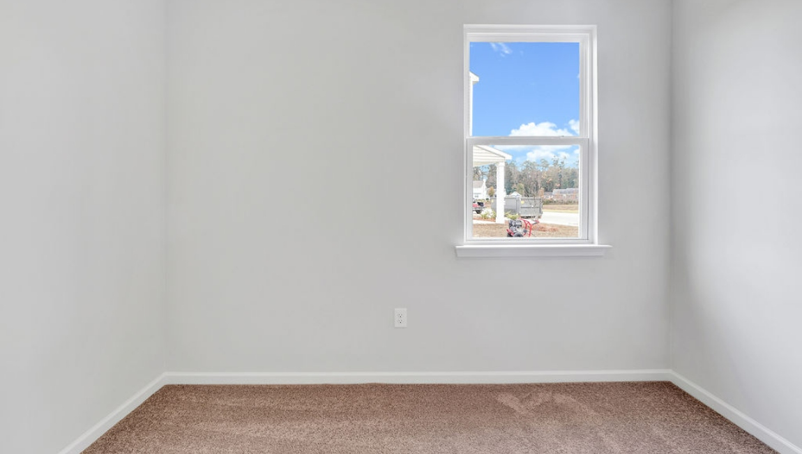 At the front are two guest bedrooms and a full bathroom, perfect for visitors or a home office.