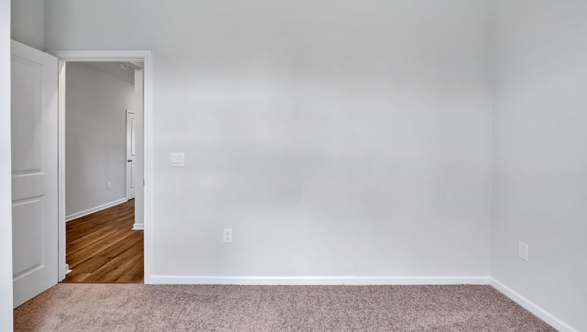 At the front are two guest bedrooms and a full bathroom, perfect for visitors or a home office.