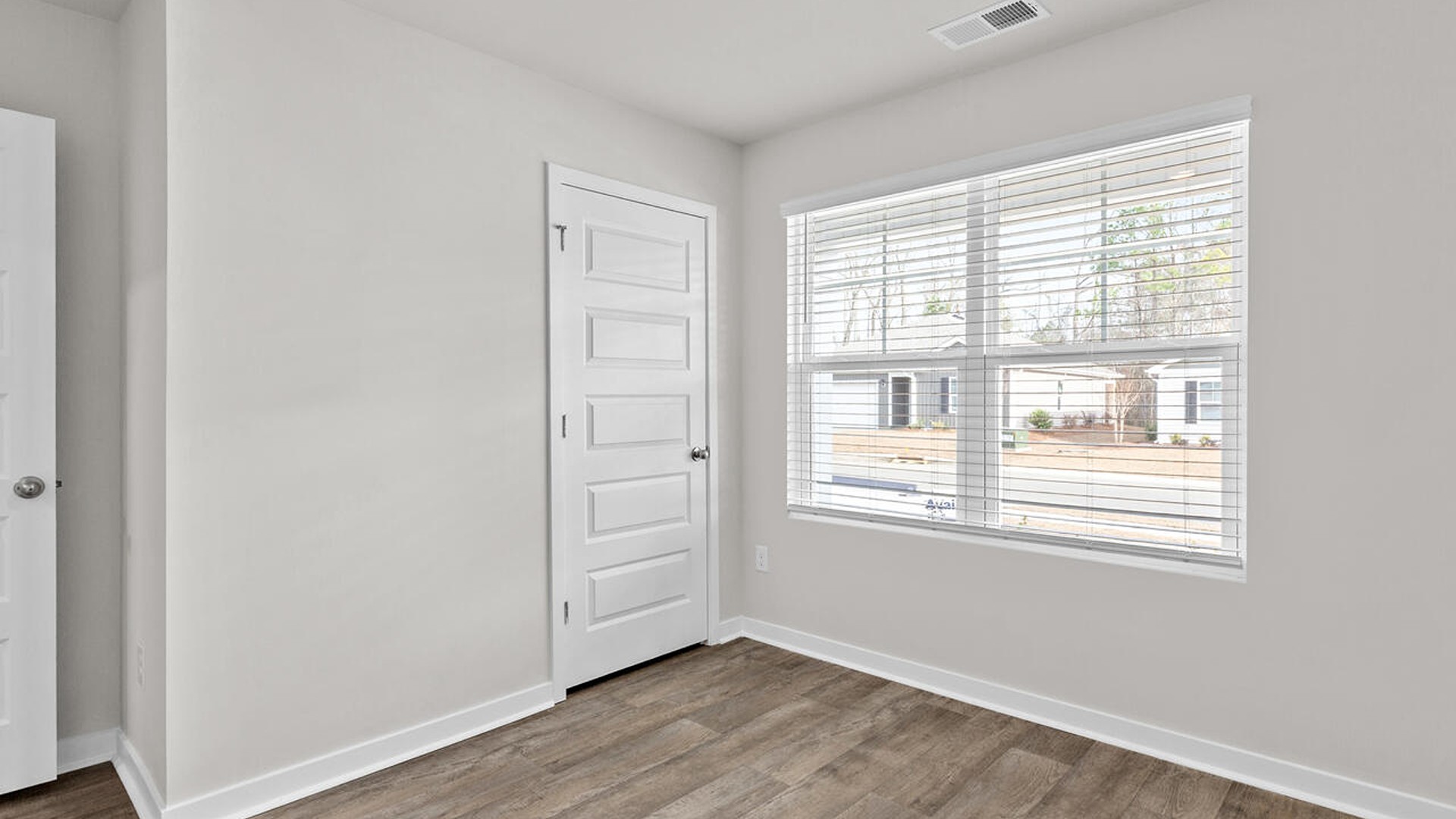 There are three additional bedrooms and full bath. In every bedroom you’ll have vinyl flooring and a closet in each room.