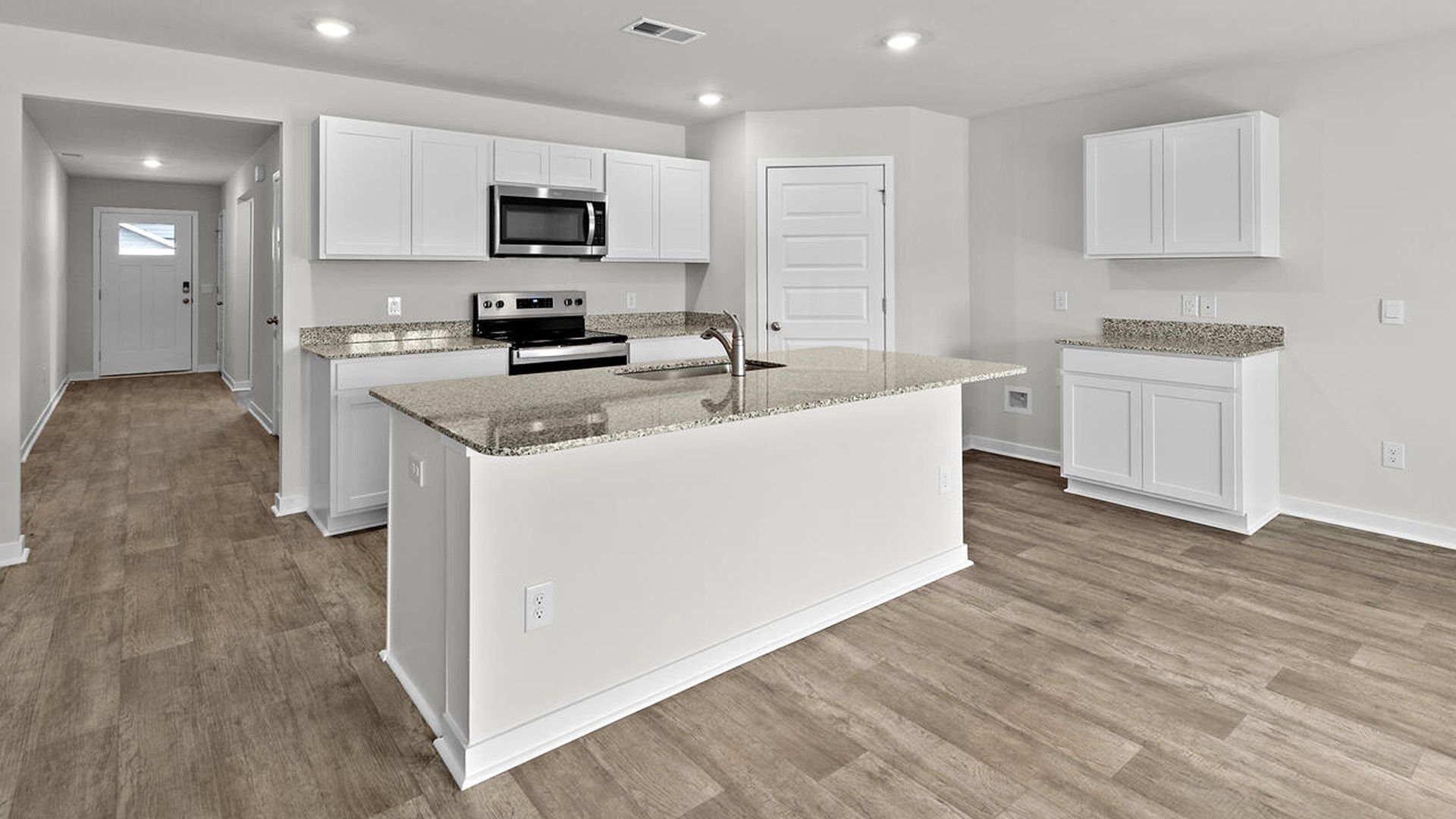 The kitchen features beautiful cabinets, granite countertops, and stainless-steel appliances, which are sure to both turn heads and make meal prep easy.