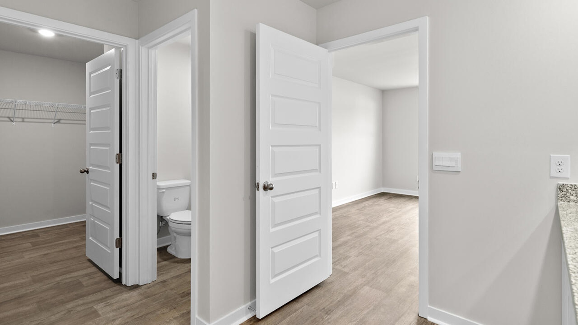 The primary bedroom has its own attached bathroom that features a walk-in closet and all the space you need to get ready in the morning.