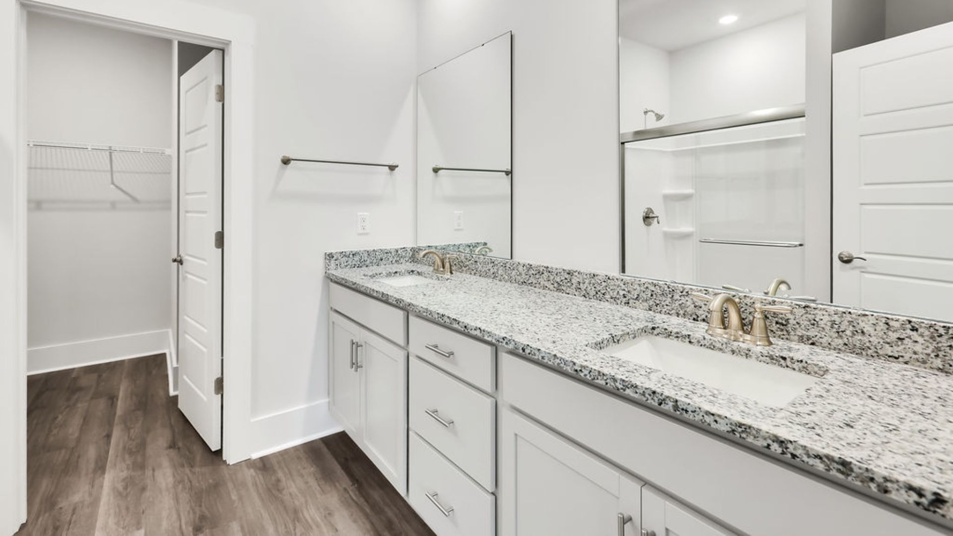 The primary bedroom has its own attached bathroom that features a walk-in closet and all the space you need to get ready in the morning.