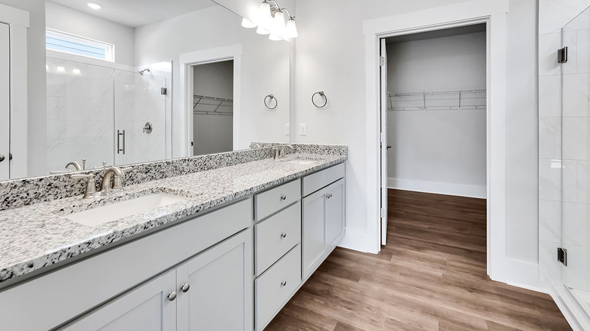 The primary bedroom has its own attached bathroom that features a walk-in closet and all the space you need to get ready in the morning