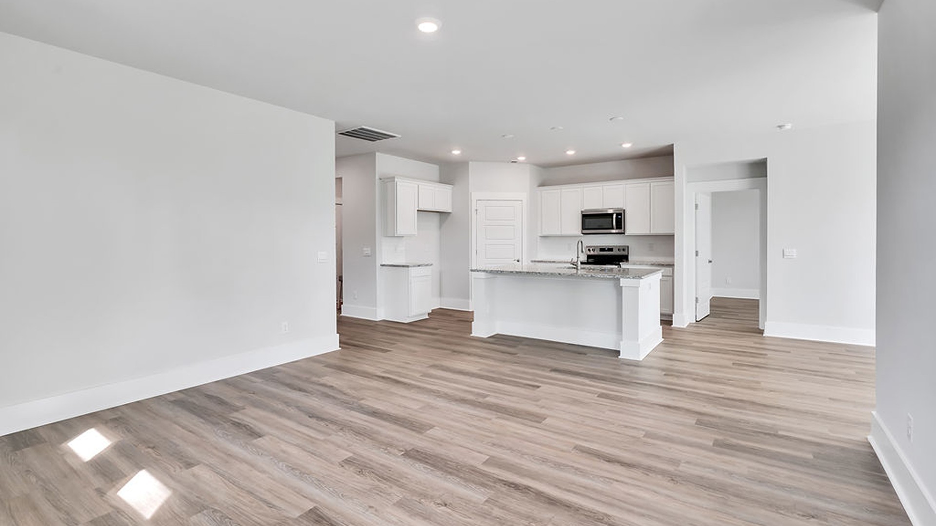The Bradford is a versatile plan with an open concept kitchen, living, and dining area! The kitchen comes finished with beautiful granite countertops, stainless steel appliances, single-bowl sink