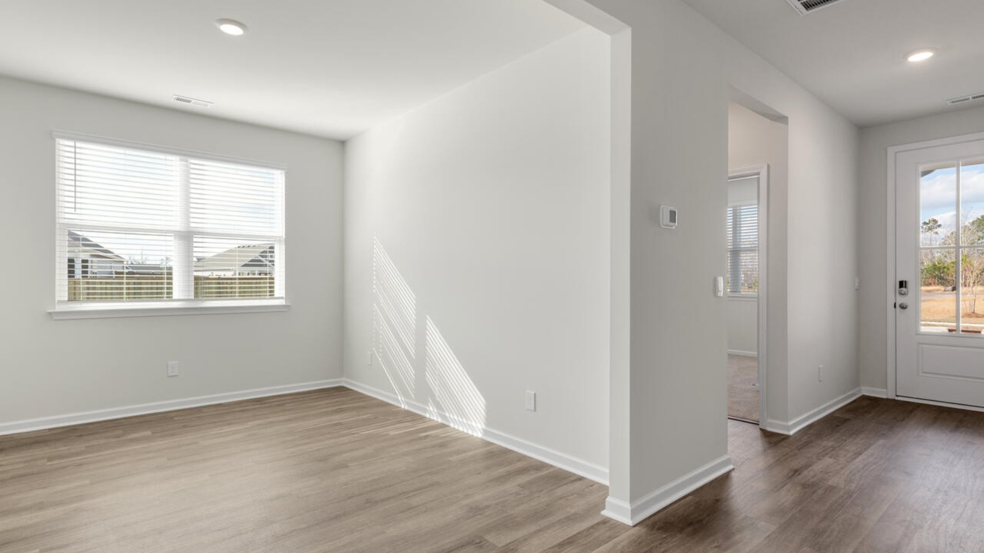 This open concept home features 9 ft. ceilings, granite kitchen counter tops, walk-in pantry, over-sized kitchen island, ample storage space, and granite countertops in the bathrooms.