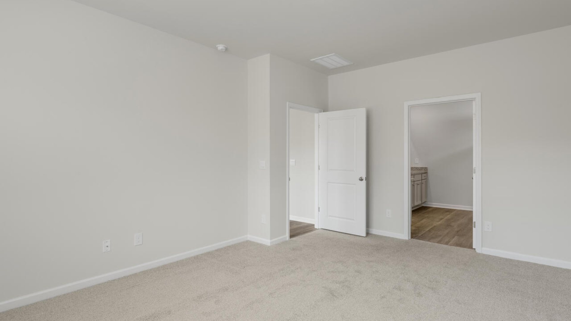 A large primary suite with bath that features separate sinks, granite countertops and a large walk-in closet. Whether these rooms become bedrooms, office spaces, or other bonus rooms, there is sure to be comfort.