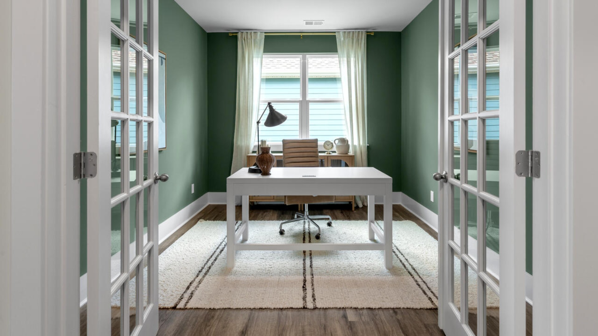 French doors lead into the private study/office area.