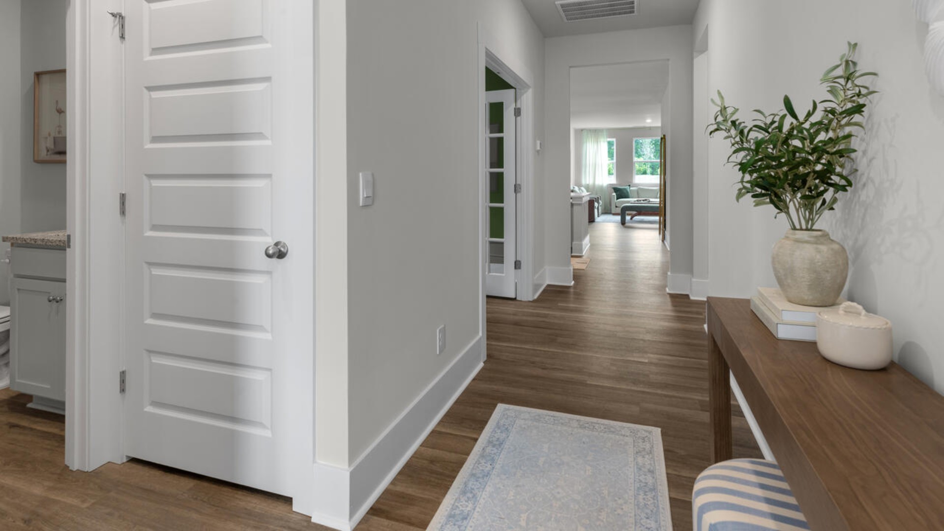 This open concept home features 9 ft. ceilings, granite kitchen counter tops, walk-in pantry, over-sized kitchen island, ample storage space, and granite countertops in the bathrooms.