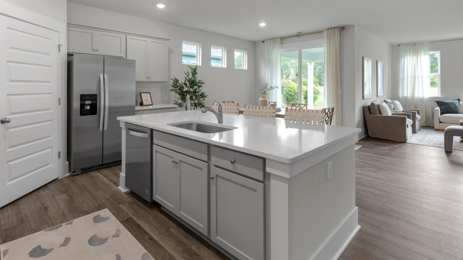 This open concept home features 9 ft. ceilings, granite kitchen counter tops, walk-in pantry, over-sized kitchen island, ample storage space, and granite countertops in the bathrooms.