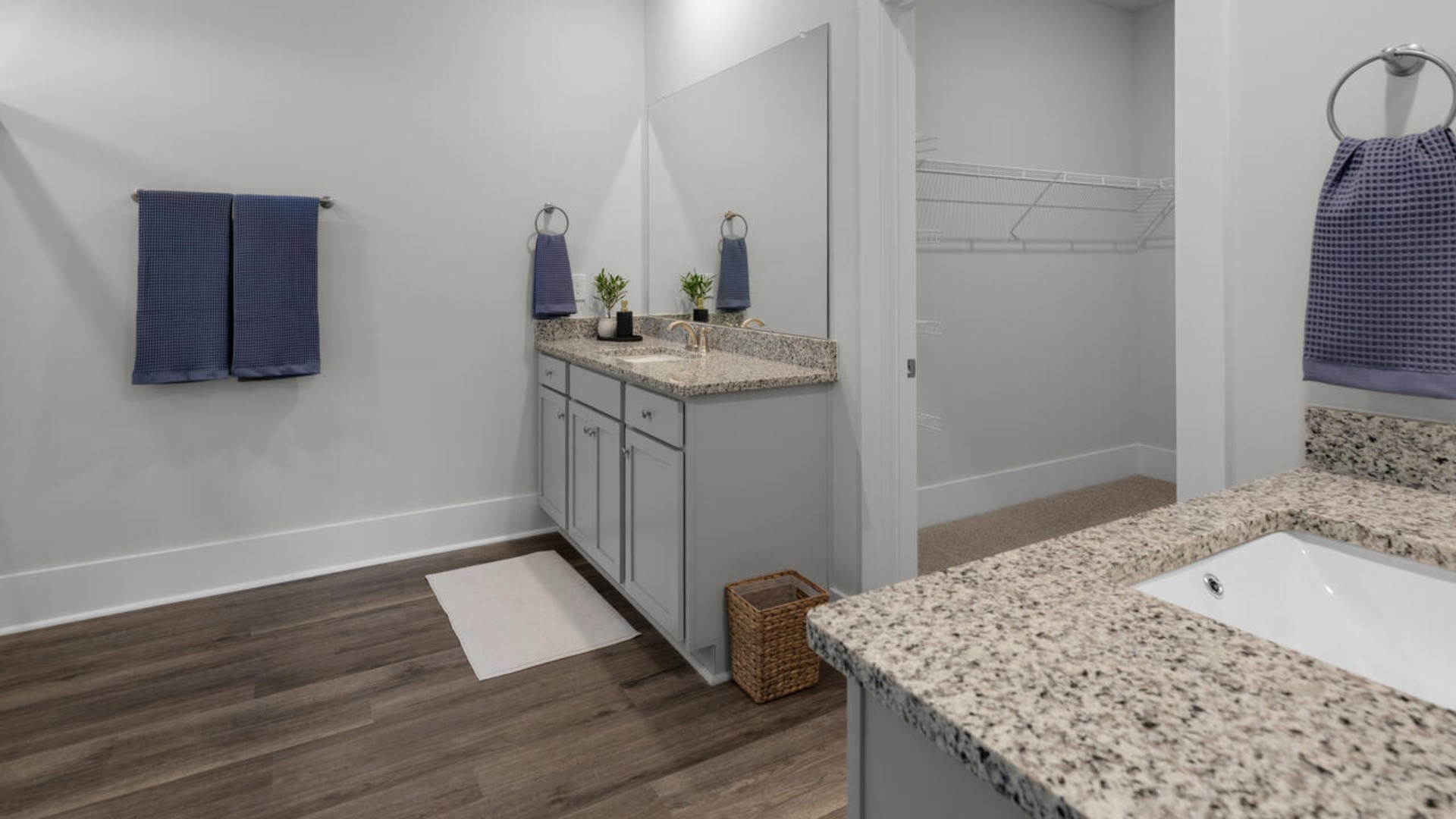 This open concept home features 9 ft. ceilings, granite kitchen counter tops, walk-in pantry, over-sized kitchen island, ample storage space, and granite countertops in the bathrooms.