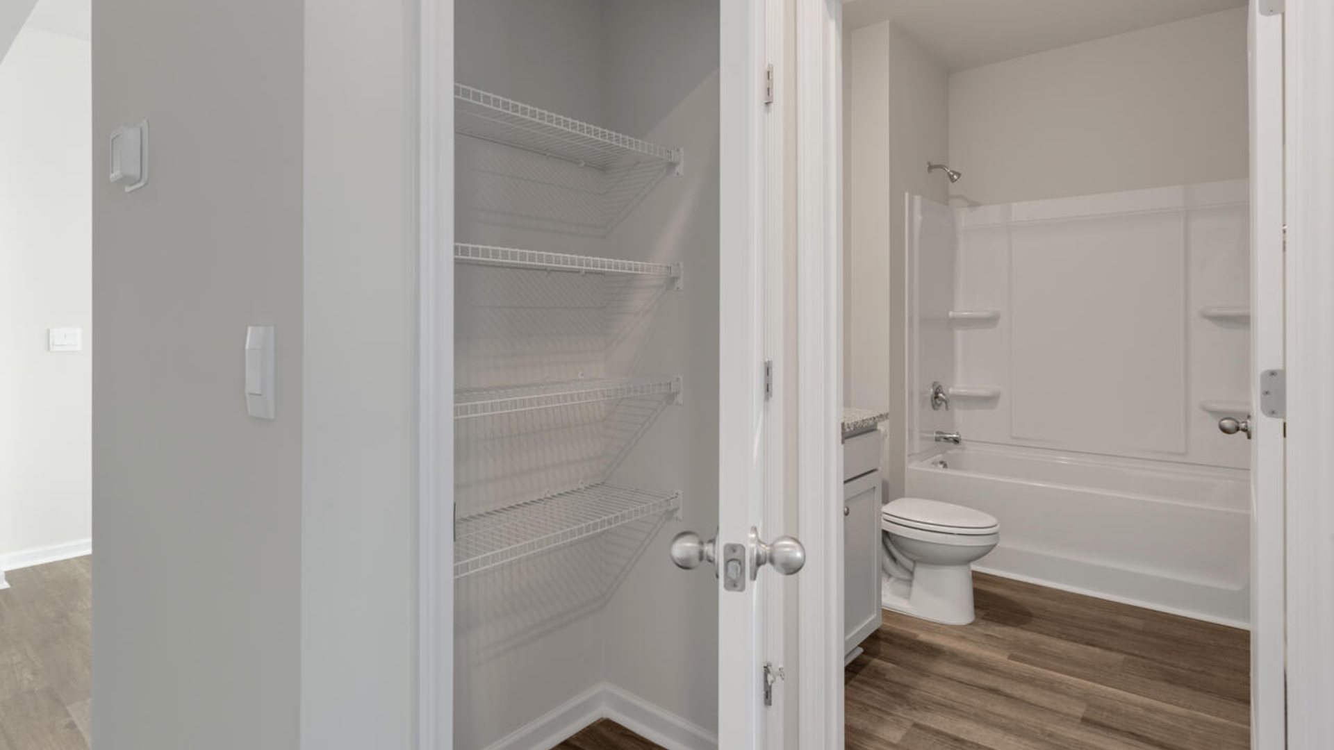 This new home will feature 9 ft. ceilings, quartz kitchen countertops, granite countertops in the two full bathrooms, luxury vinyl plank flooring throughout the home