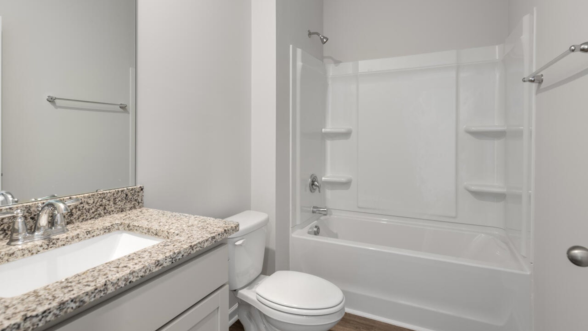 This new home will feature 9 ft. ceilings, quartz kitchen countertops, granite countertops in the two full bathrooms, luxury vinyl plank flooring throughout the home