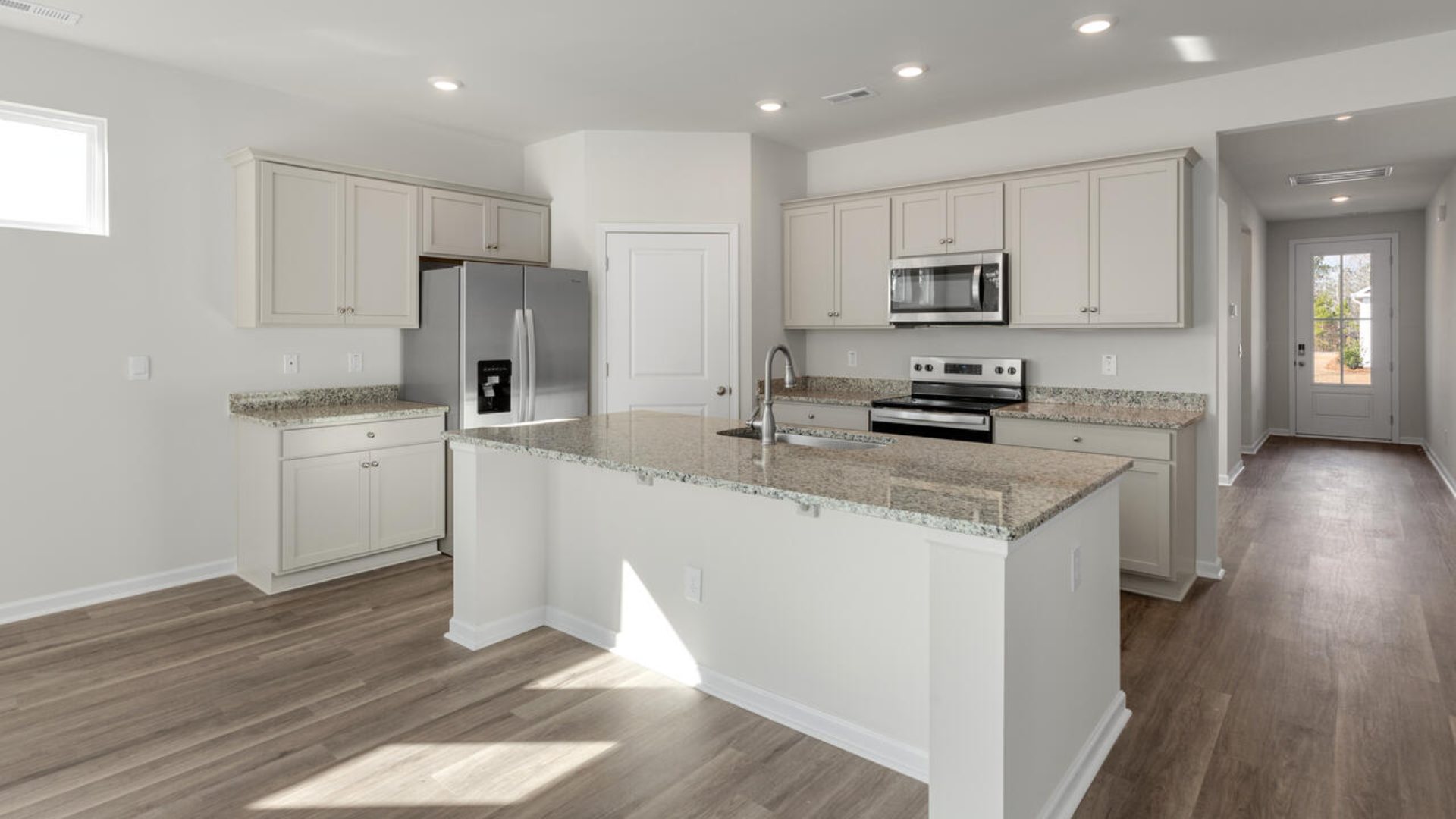 This new home will feature 9 ft. ceilings, quartz kitchen countertops