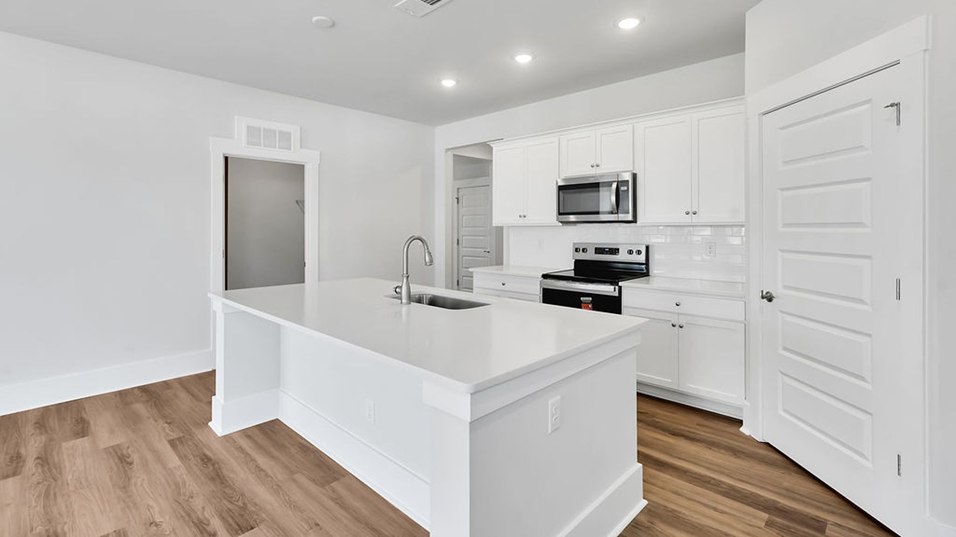 This new home will feature 9 ft. ceilings, granite kitchen countertops, tile backsplash, granite countertops in the two full bathrooms and luxury vinyl plank flooring throughout, a cozy screened in patio and a covered front porch!