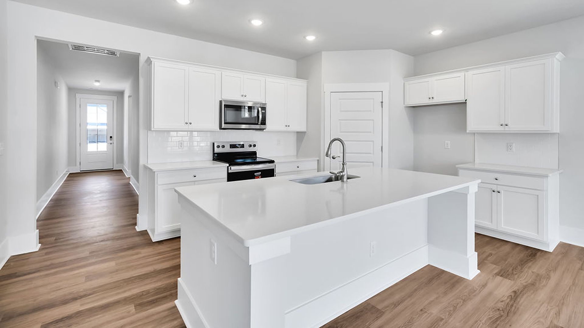 This new home will feature 9 ft. ceilings, granite kitchen countertops, tile backsplash, granite countertops in the two full bathrooms and luxury vinyl plank flooring throughout, a cozy screened in patio and a covered front porch!