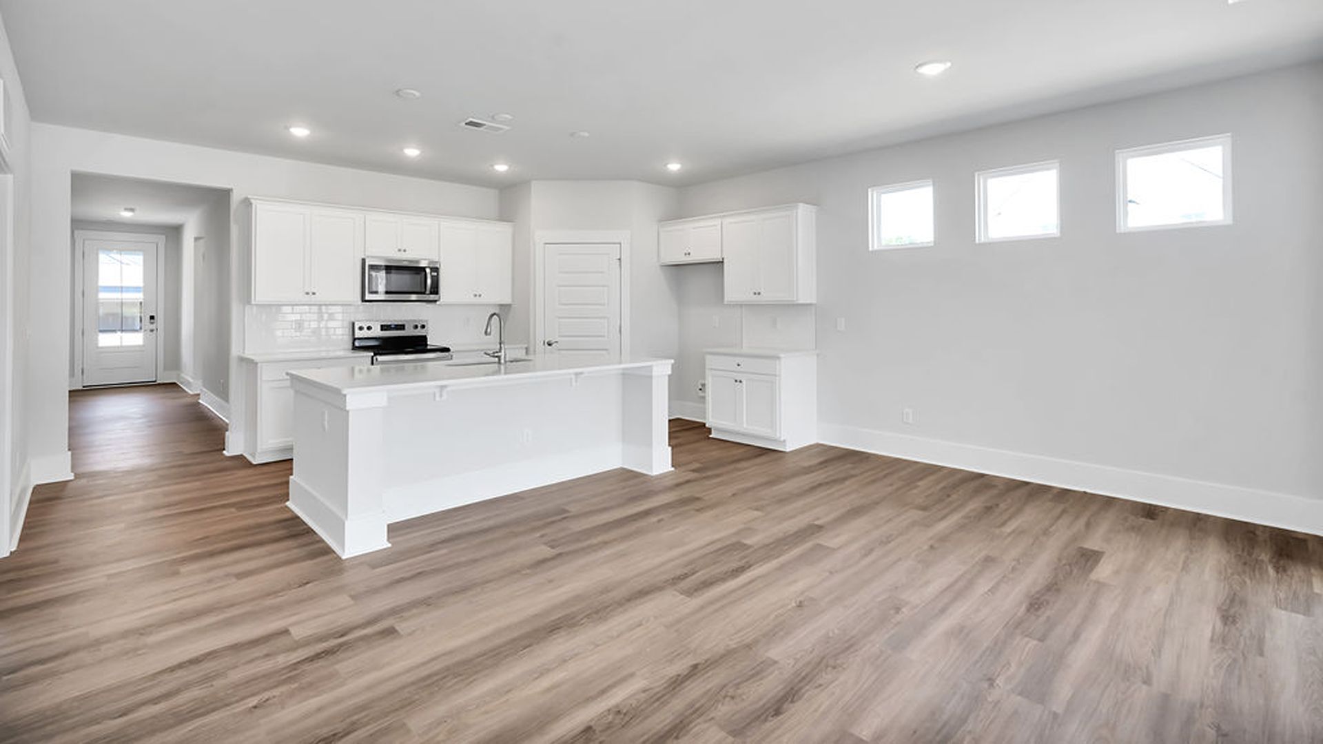 This new home will feature 9 ft. ceilings, granite kitchen countertops, tile backsplash, granite countertops in the two full bathrooms and luxury vinyl plank flooring throughout, a cozy screened in patio and a covered front porch!