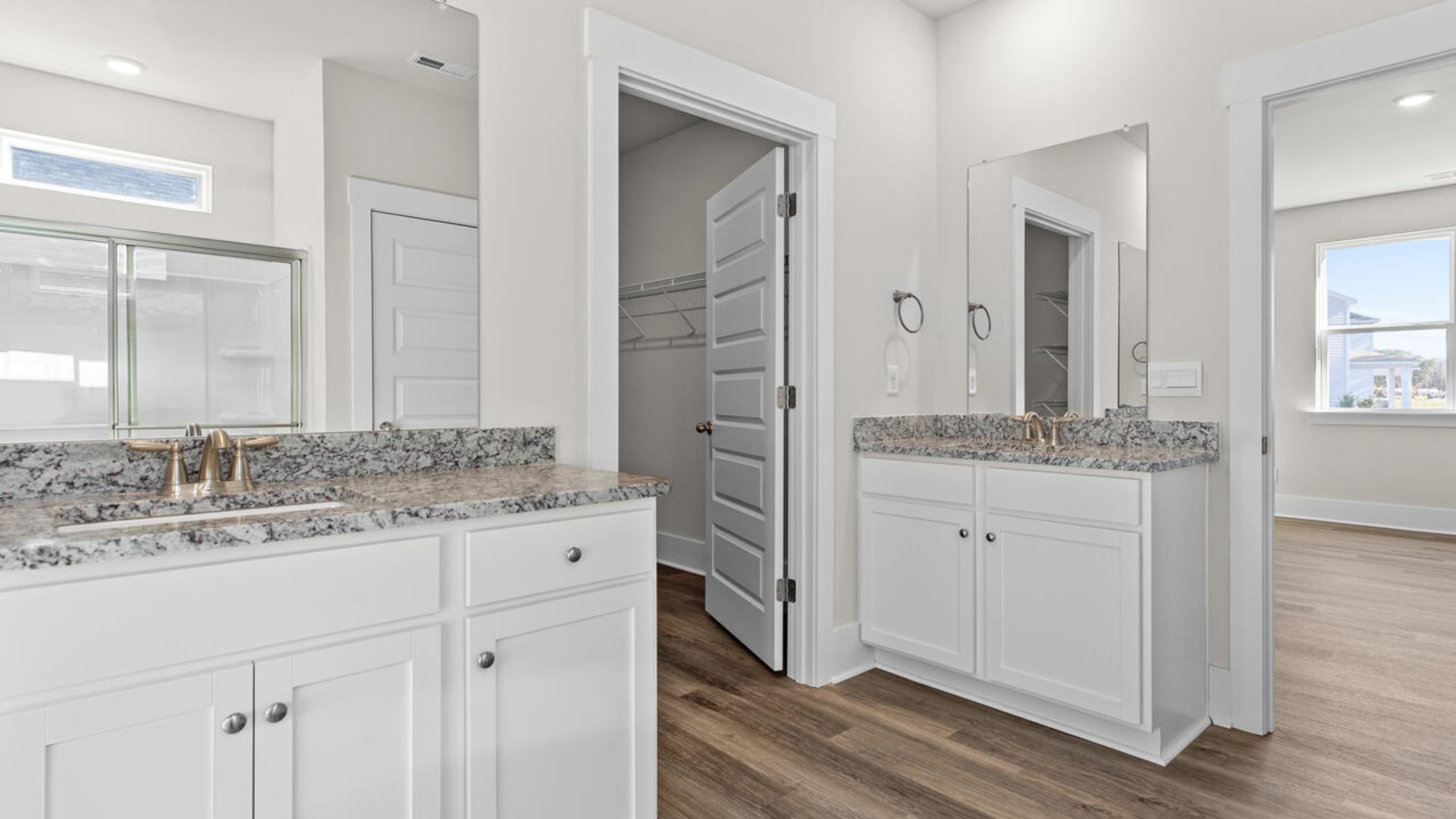 The primary bedroom has its own attached bathroom that features a walk-in closet and all the space you need to get ready in the morning.