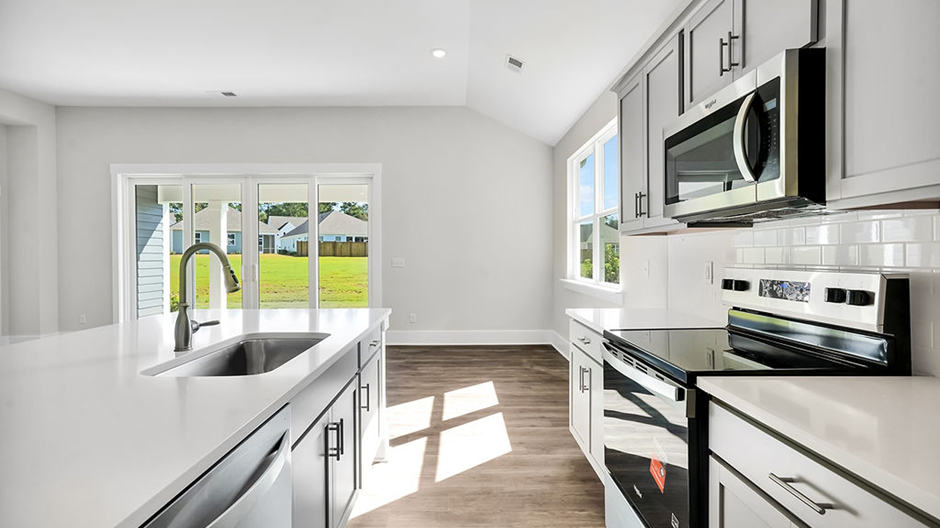 The Litchfield is a perfect home for relaxation and entertaining with a very open floor plan, 11-foot-high ceiling, and a large gourmet kitchen with granite countertops, tile backsplash, walk-in pantry, and stainless-steel appliances in kitchen.
