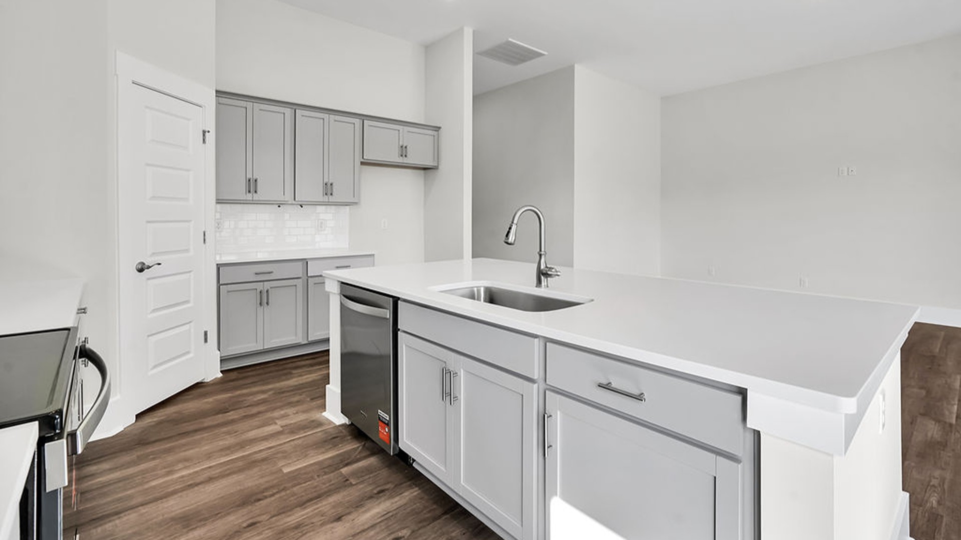 The Litchfield is a perfect home for relaxation and entertaining with a very open floor plan, 11-foot-high ceiling, and a large gourmet kitchen with granite countertops, tile backsplash, walk-in pantry, and stainless-steel appliances in kitchen.