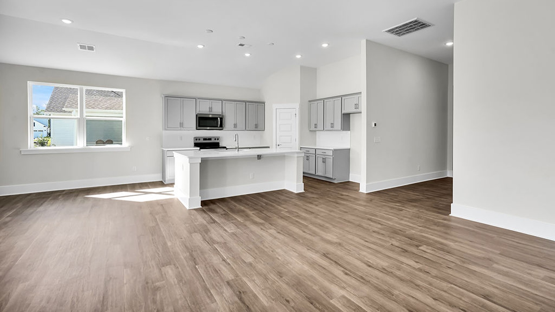 The living area is an open concept, where your kitchen, living, and dining areas blend seamlessly into a space perfect for everyday living and entertaining.
