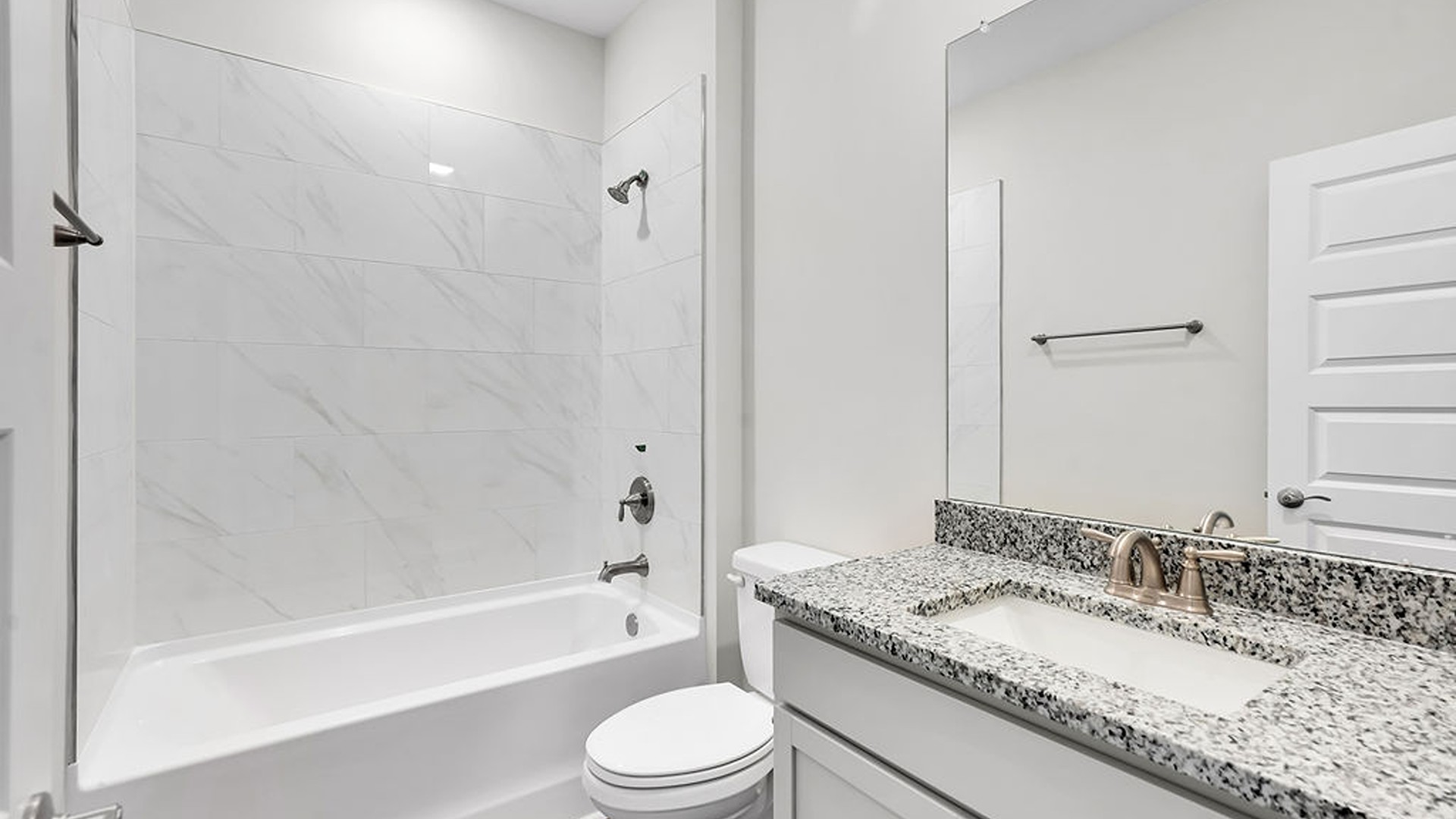 The primary suite features a step-in 5-foot shower and dual vanity.