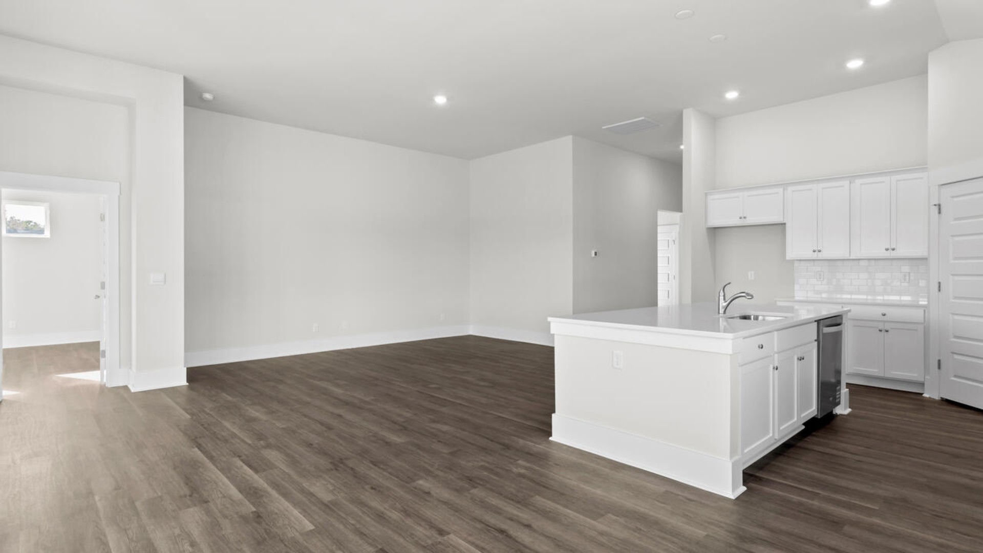 High ceilings and lots of windows create a bright and airy entertaining space. Open concept design with plenty of room for everyone to gather around the huge kitchen island.