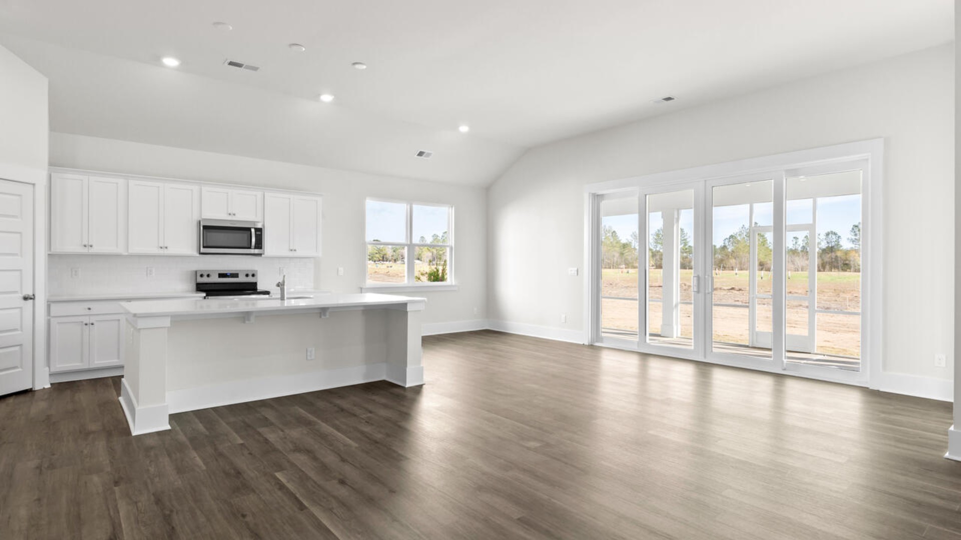 High ceilings and lots of windows create a bright and airy entertaining space. Open concept design with plenty of room for everyone to gather around the huge kitchen island.
