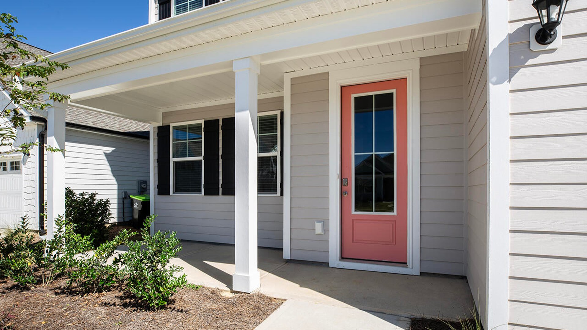 Featuring a formal dining room adjoining the kitchen, large island with quartz countertops, and open concept living space.
