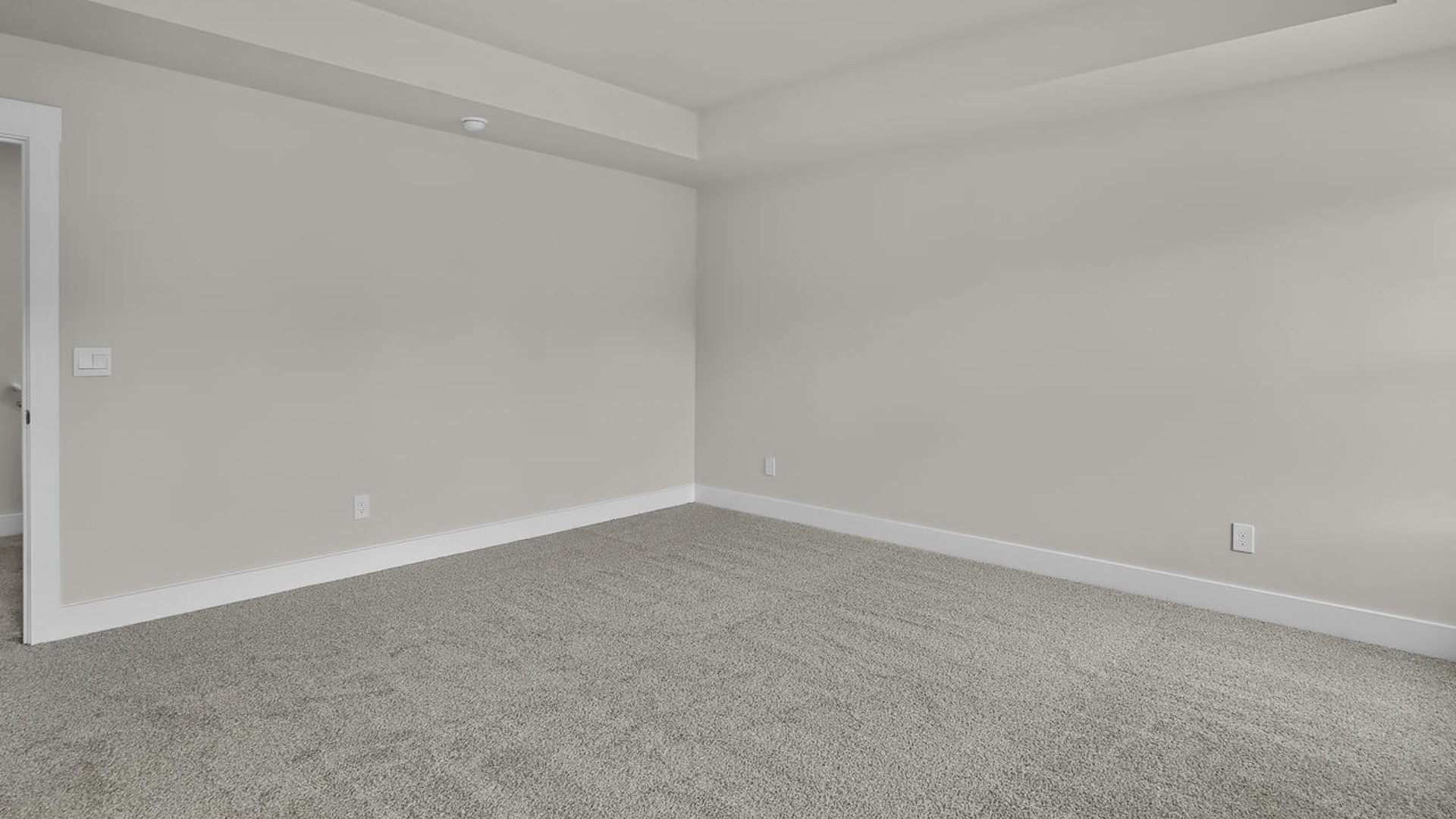 The primary suite features a sitting room, walk-in closet, trayed ceiling, a step-in 5-foot shower, dual vanity with granite countertops, and natural light in the bathroom.