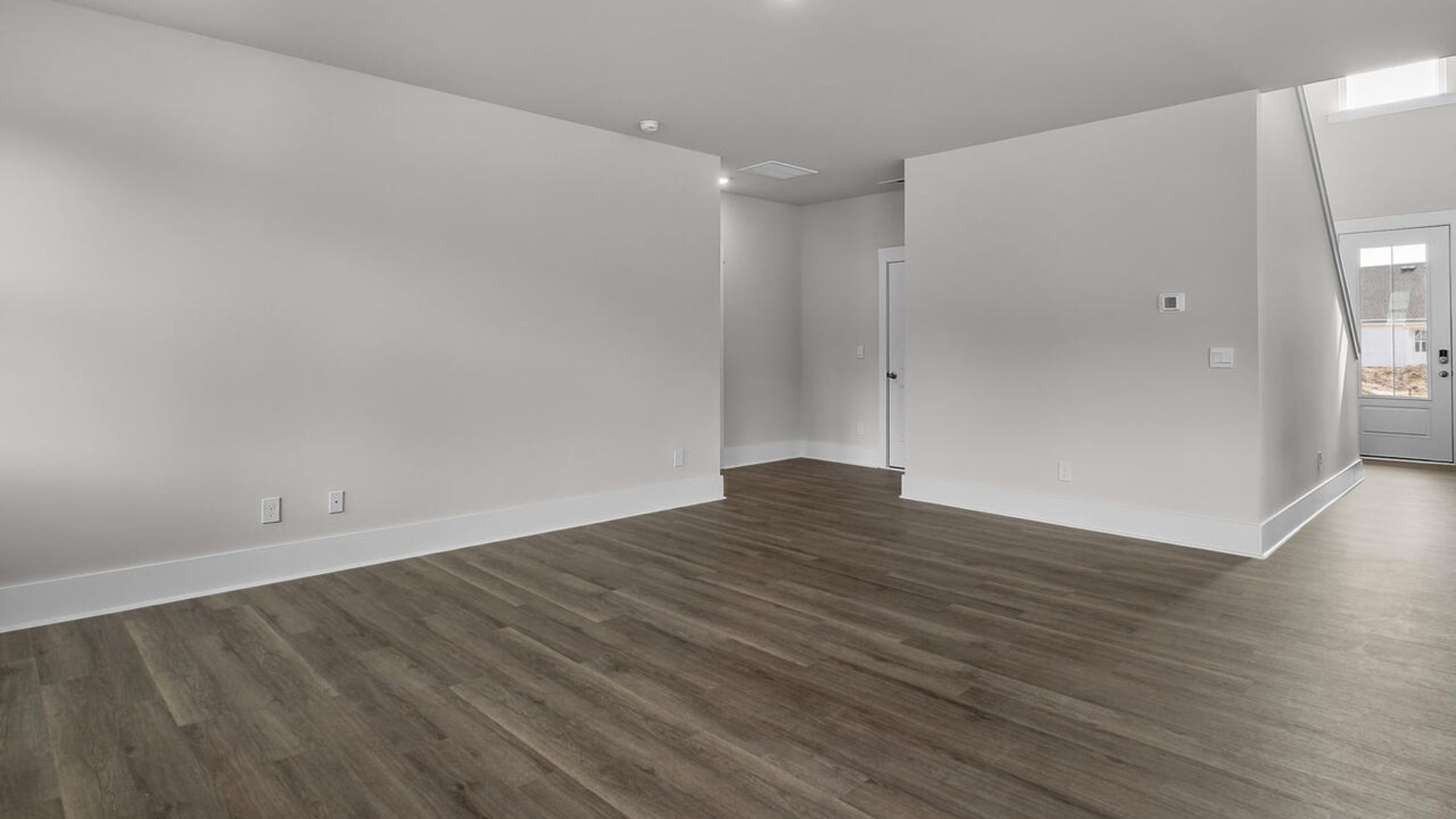 eaturing a formal dining room adjoining the kitchen, large island with granite countertops, and open concept living space.