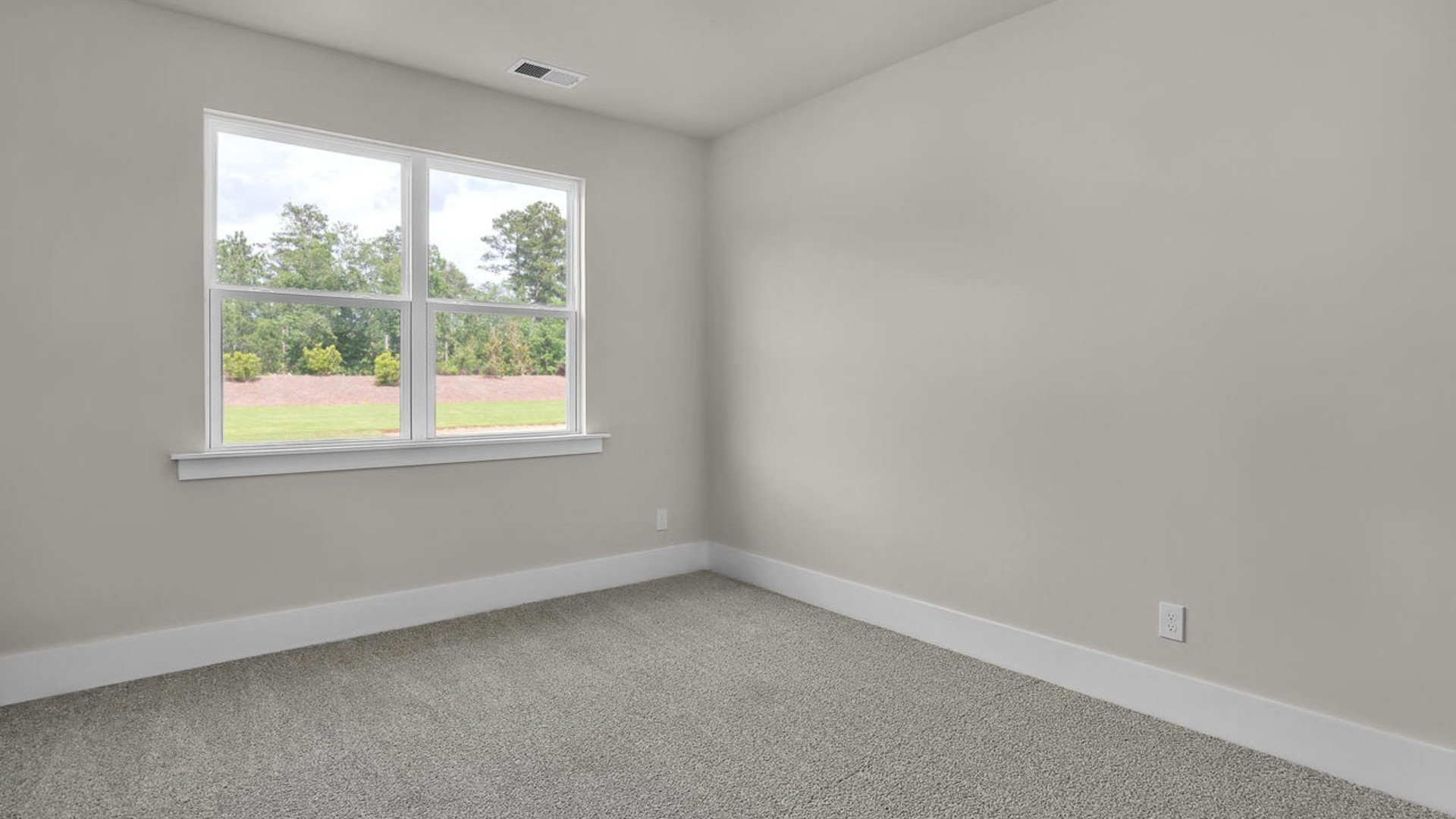 The primary suite features a sitting room, walk-in closet, trayed ceiling, a step-in 5-foot shower, dual vanity with granite countertops, and natural light in the bathroom.