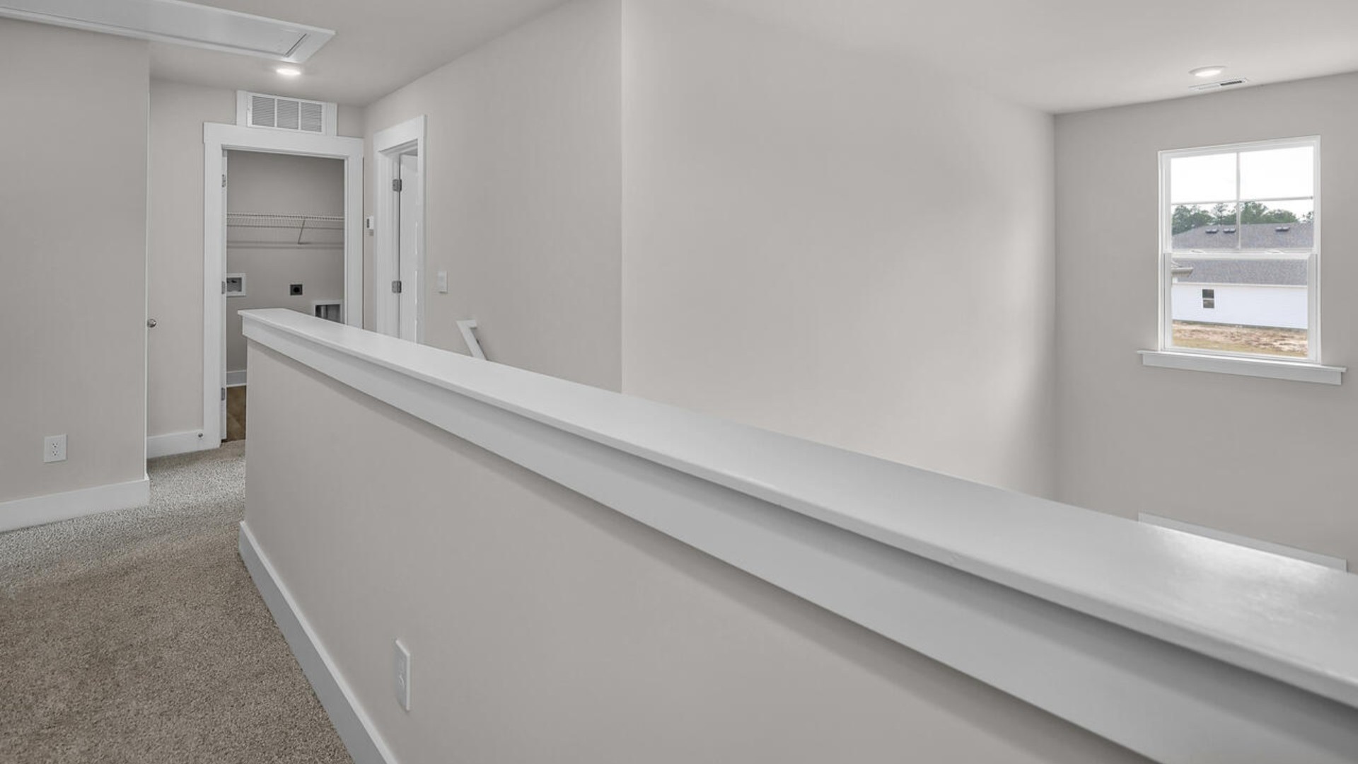 The primary suite features a sitting room, walk-in closet, trayed ceiling, a step-in 5-foot shower, dual vanity with granite countertops, and natural light in the bathroom.