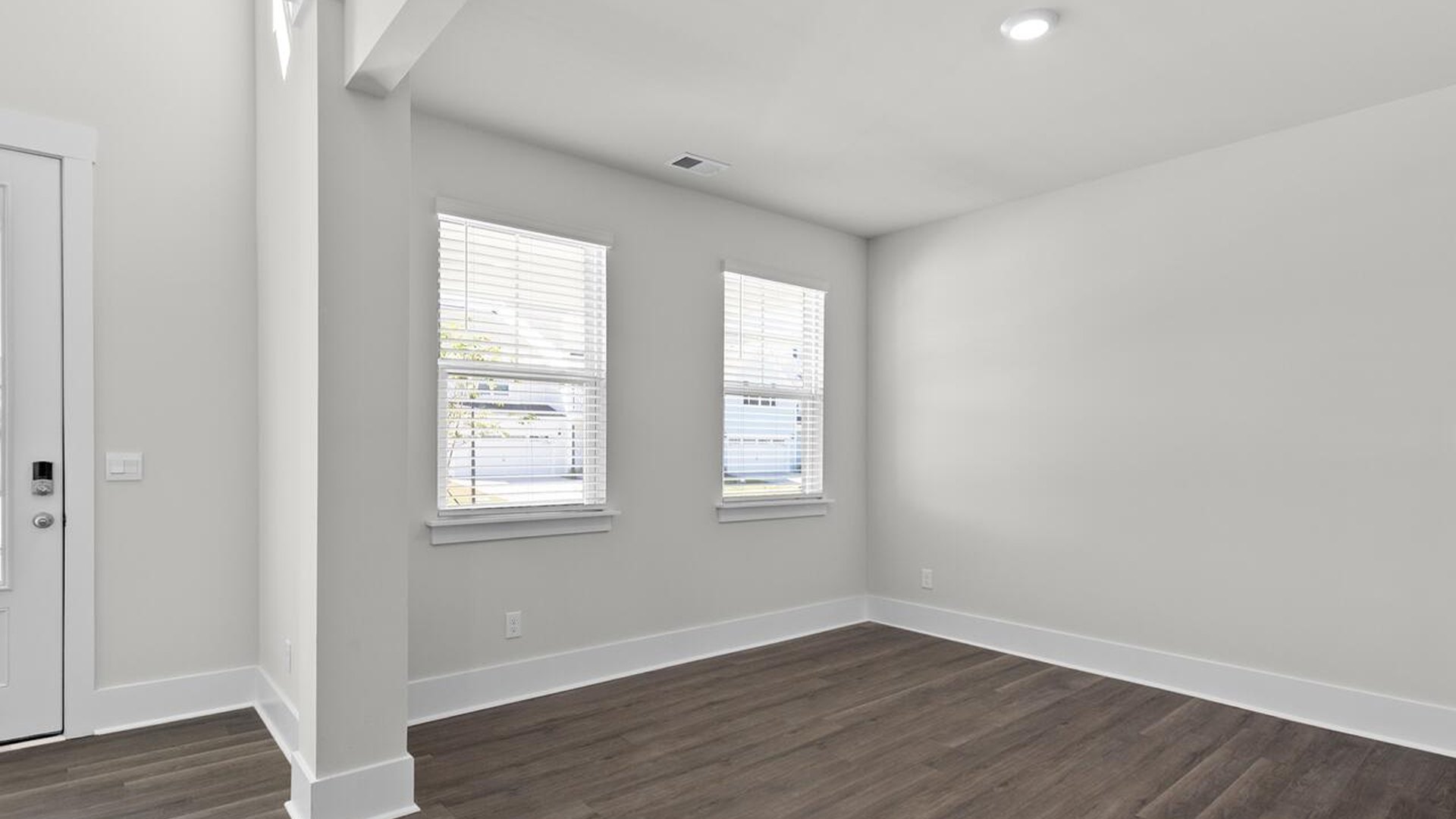 Featuring a formal dining room adjoining the kitchen, large island with granite countertops, and open concept living space.