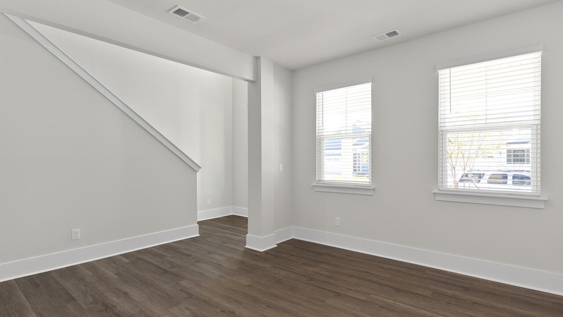Featuring a formal dining room adjoining the kitchen, large island with granite countertops, and open concept living space.
