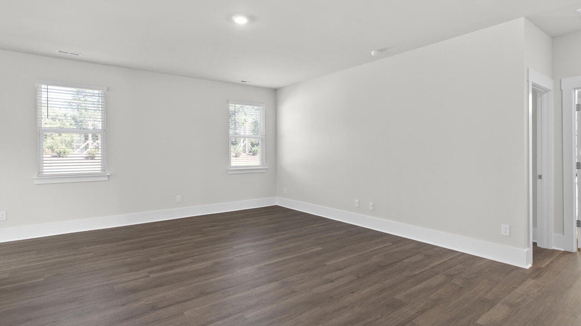 Featuring a formal dining room adjoining the kitchen, large island with granite countertops, and open concept living space.