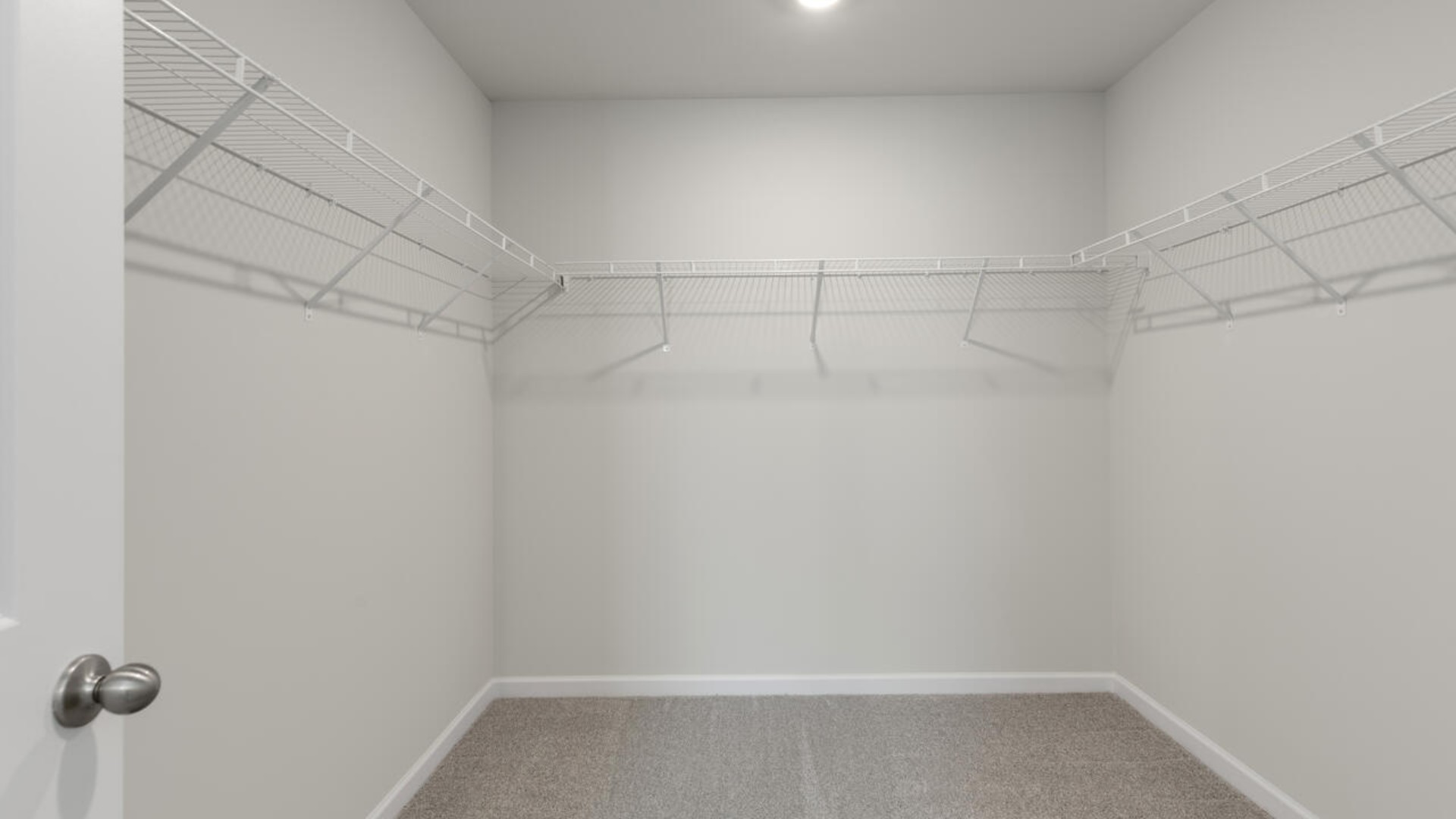 The Forrester's second floor includes a primary retreat with a substantial walk-in closet, laundry room, and a large bonus room.