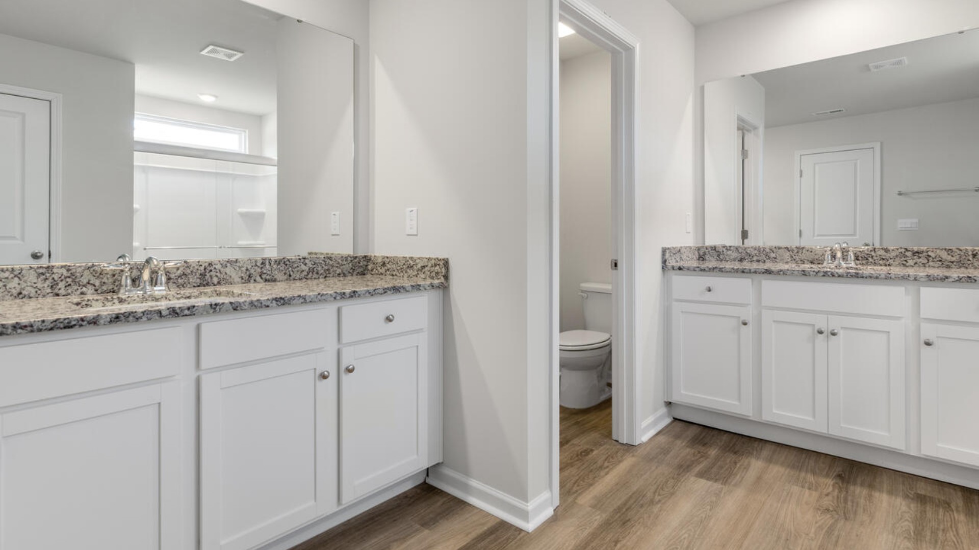 The primary suite spans the whole back of the home with a sitting room. The primary suite bath features a step-in 5' shower and a dual vanity. Large upstairs loft with closets for storage. Upstairs you are greeted by a convenient loft, a laundry room, and the primary retreat, which boasts the suite's sitting room and substantial walk-in closet.