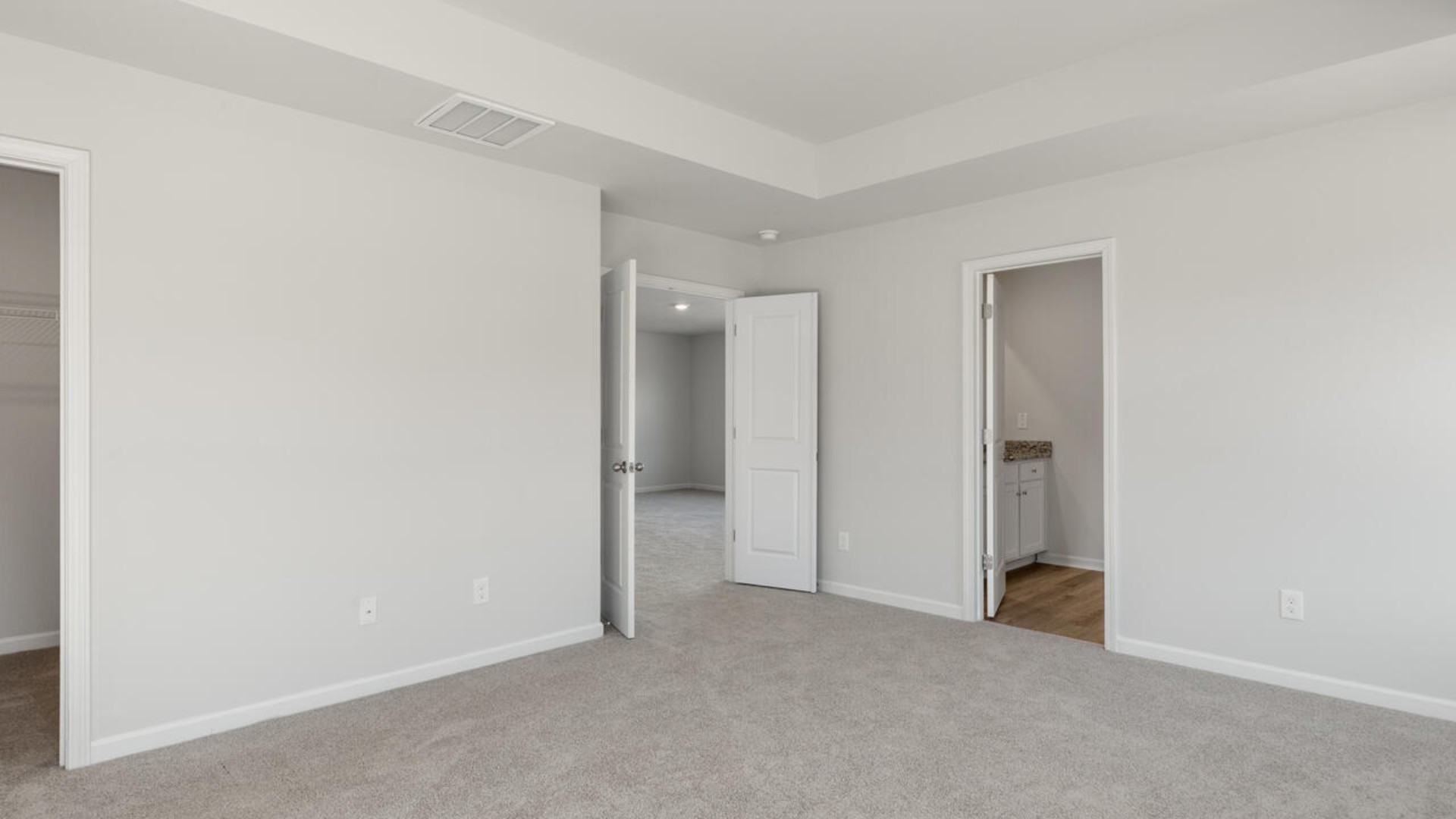 Large upstairs loft with closets for storage. Upstairs you are greeted by a convenient loft, a laundry room, and the primary retreat, which boasts the suite's sitting room and substantial walk-in closet