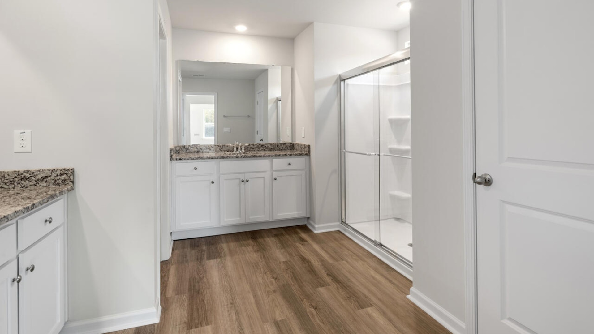 Large upstairs loft with closets for storage. Upstairs you are greeted by a convenient loft, a laundry room, and the primary retreat, which boasts the suite's sitting room and substantial walk-in closet
