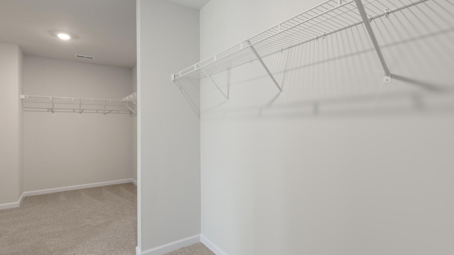 Large upstairs loft with closets for storage. Upstairs you are greeted by a convenient loft, a laundry room, and the primary retreat, which boasts the suite's sitting room and substantial walk-in closet