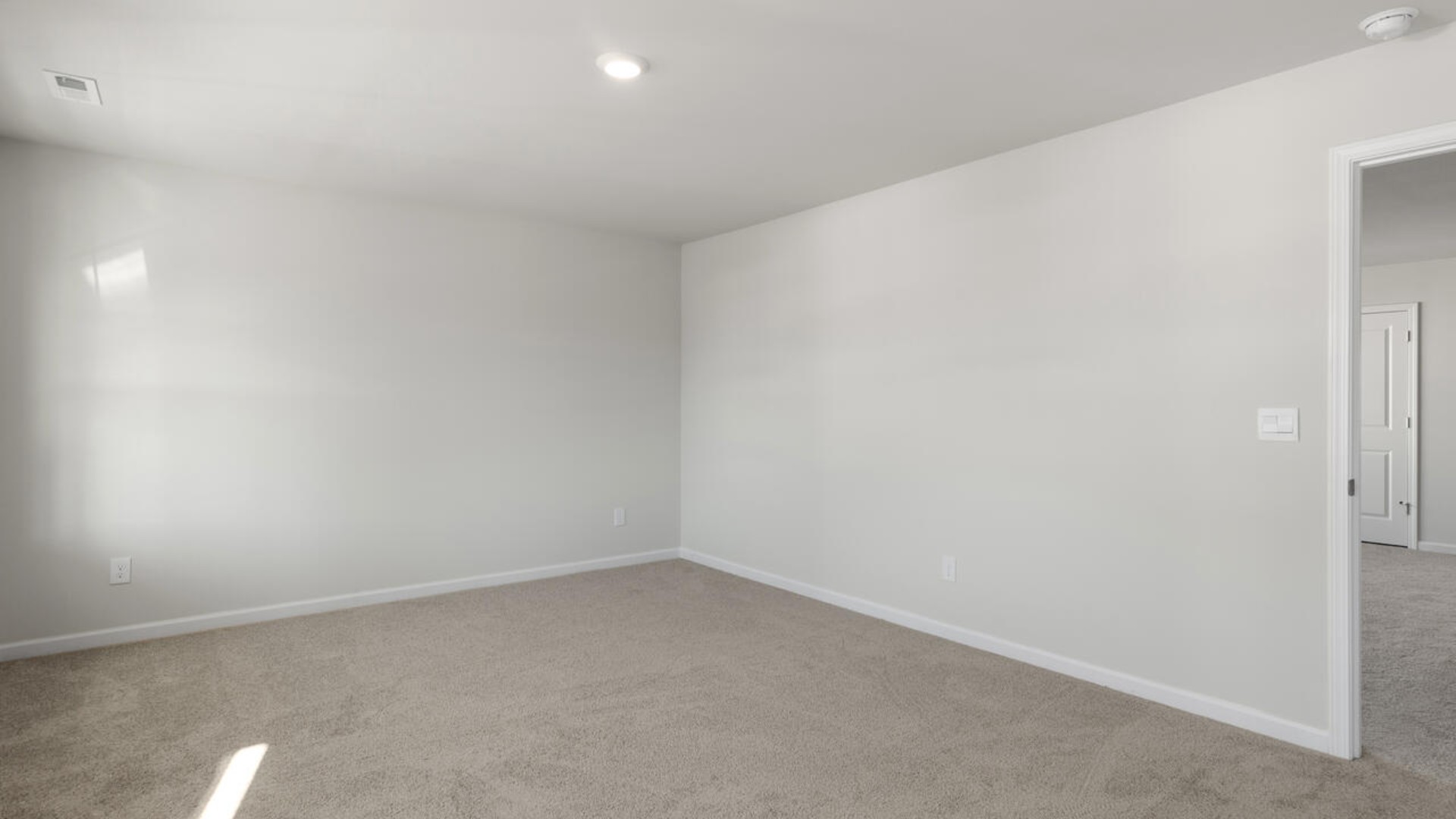 Large upstairs loft with closets for storage. Upstairs you are greeted by a convenient loft, a laundry room, and the primary retreat, which boasts the suite's sitting room and substantial walk-in closet