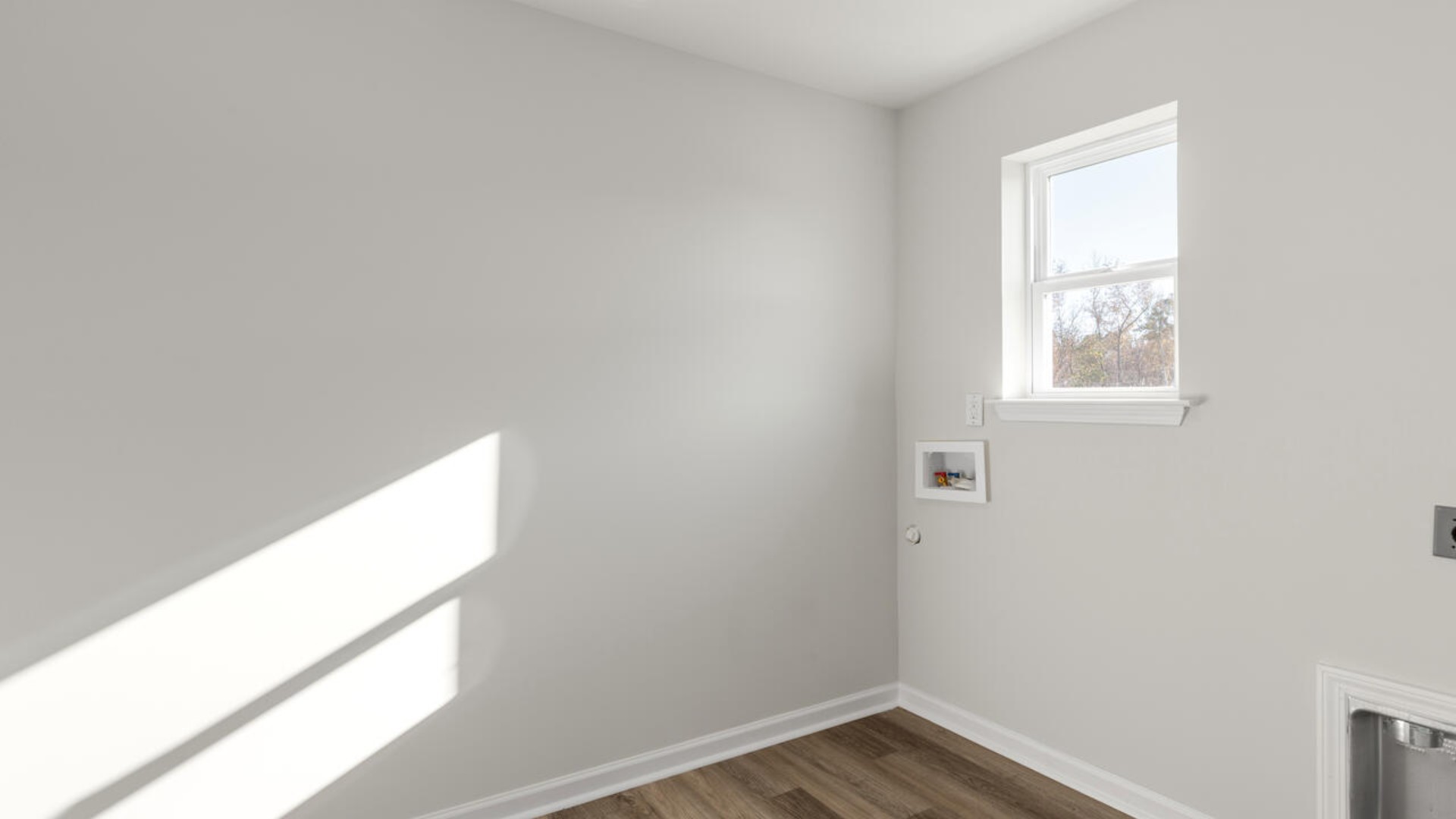 Large upstairs loft with closets for storage. Upstairs you are greeted by a convenient loft, a laundry room, and the primary retreat, which boasts the suite's sitting room and substantial walk-in closet