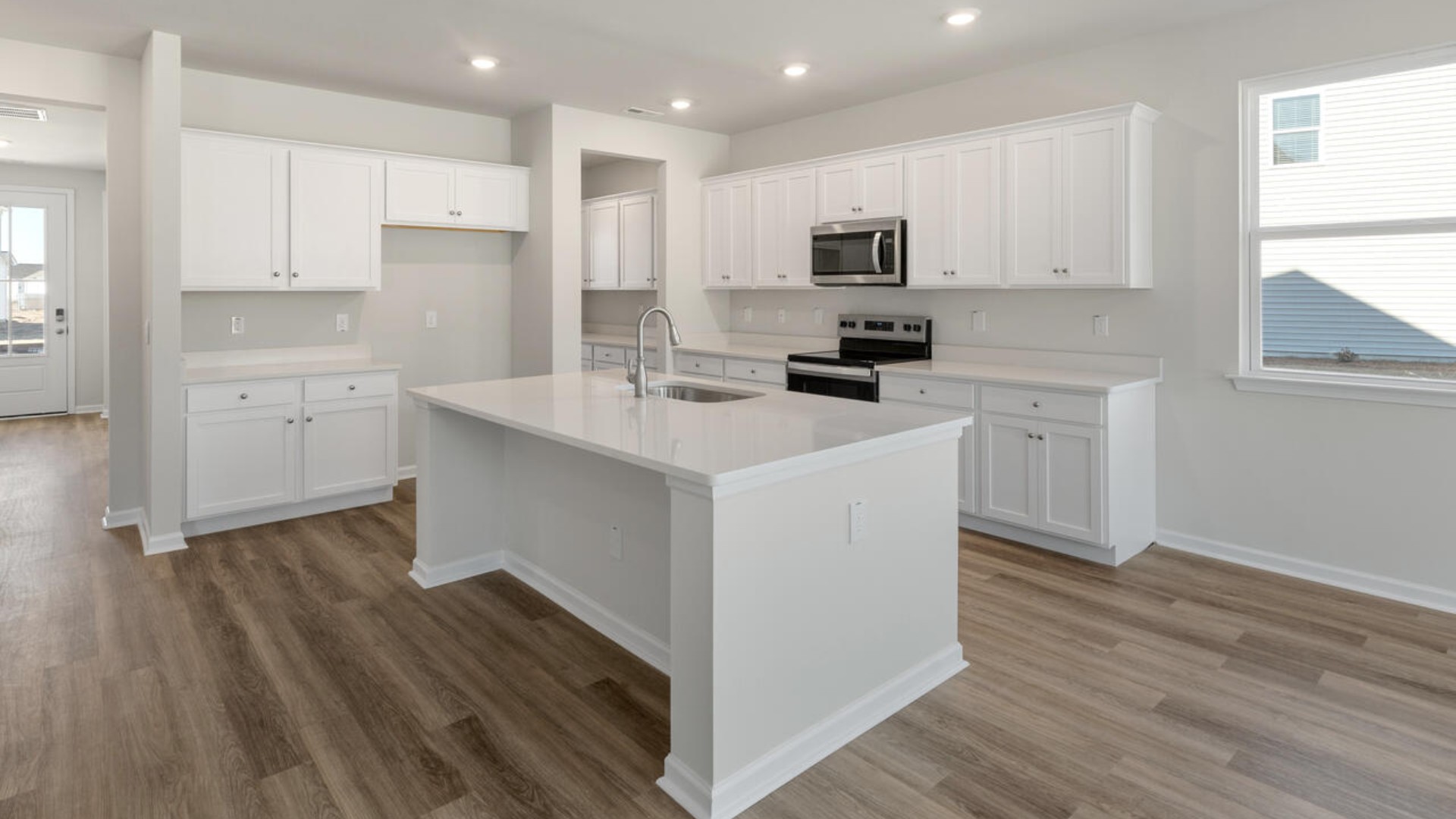 Downstairs there is a formal dining room that leads into a large butler's pantry then the kitchen. The kitchen is loaded with features including a granite island, 36'' cabinets, stainless-steel appliances and opens up to the living room.