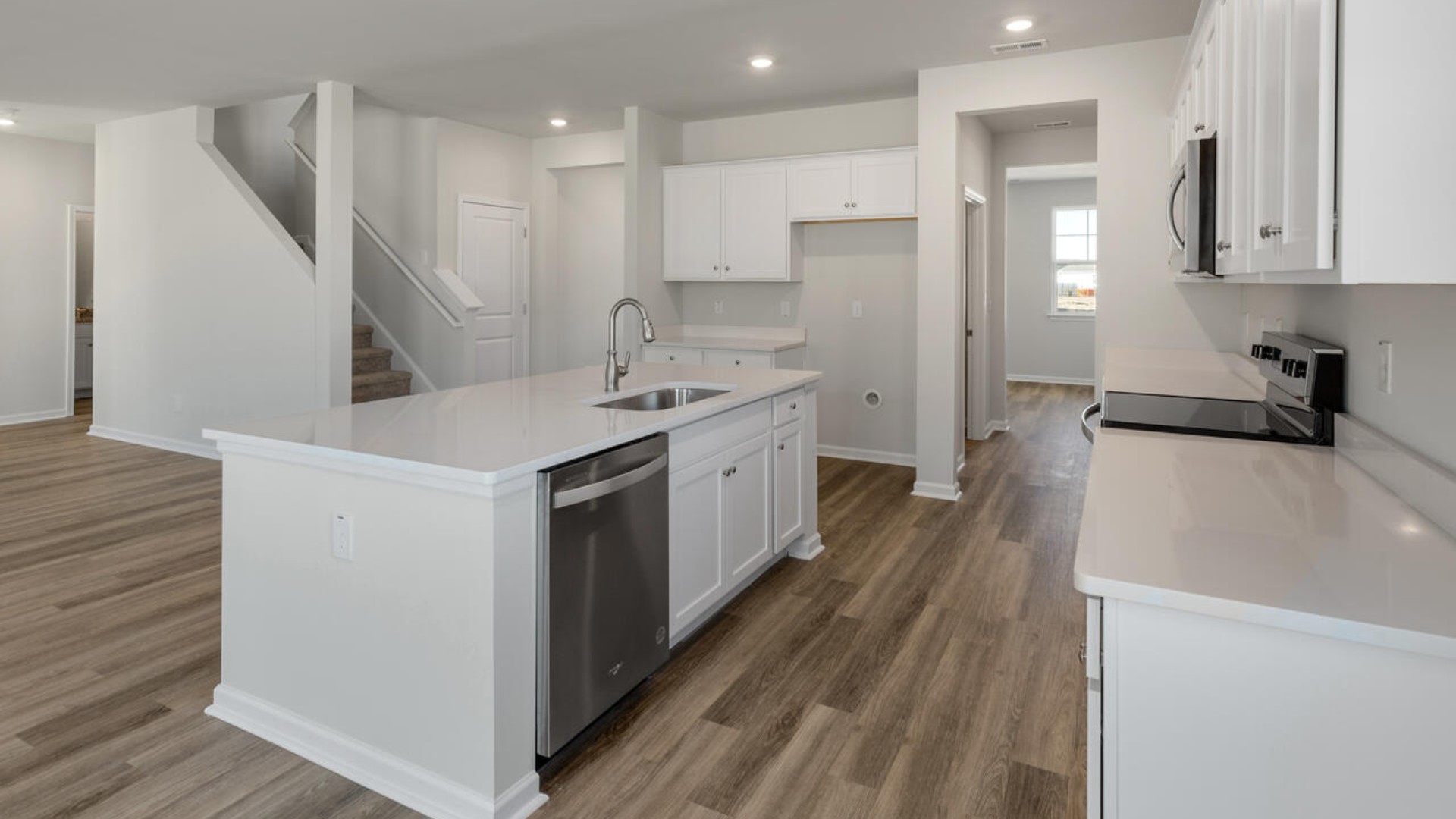 Downstairs there is a formal dining room that leads into a large butler's pantry then the kitchen. The kitchen is loaded with features including a granite island, 36'' cabinets, stainless-steel appliances and opens up to the living room.