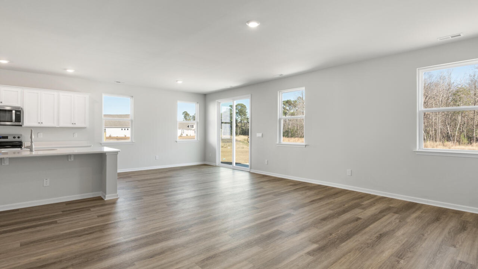 Downstairs there is a formal dining room that leads into a large butler's pantry then the kitchen. The kitchen is loaded with features including a quartz island, 36'' cabinets, stainless-steel appliances and opens up to the living room.