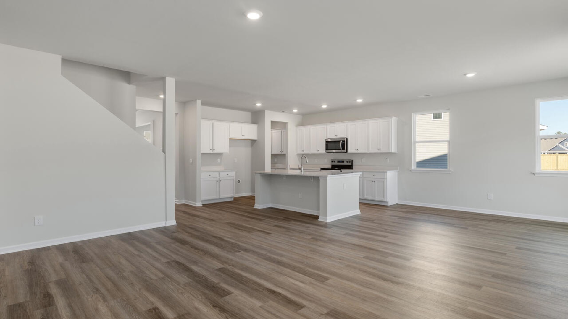 Downstairs there is a formal dining room that leads into a large butler's pantry then the kitchen. The kitchen is loaded with features including a quartz island, 36'' cabinets, stainless-steel appliances and opens up to the living room.