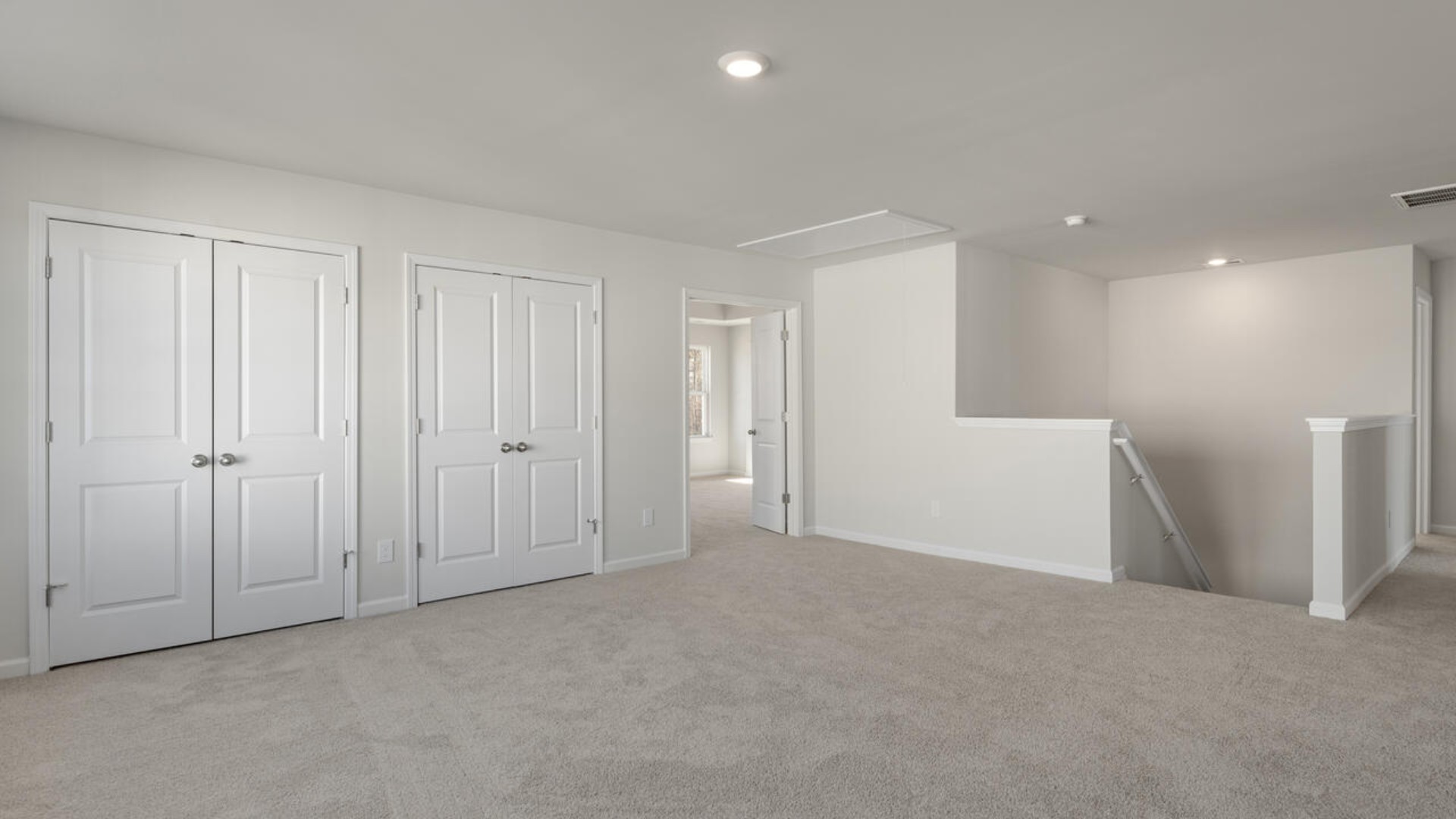 . The large loft in the center of the second floor separates the primary suite from secondary bedrooms and offers endless possibilities—use it as a playroom, media room, or fitness area. The secondary bedrooms are spacious.