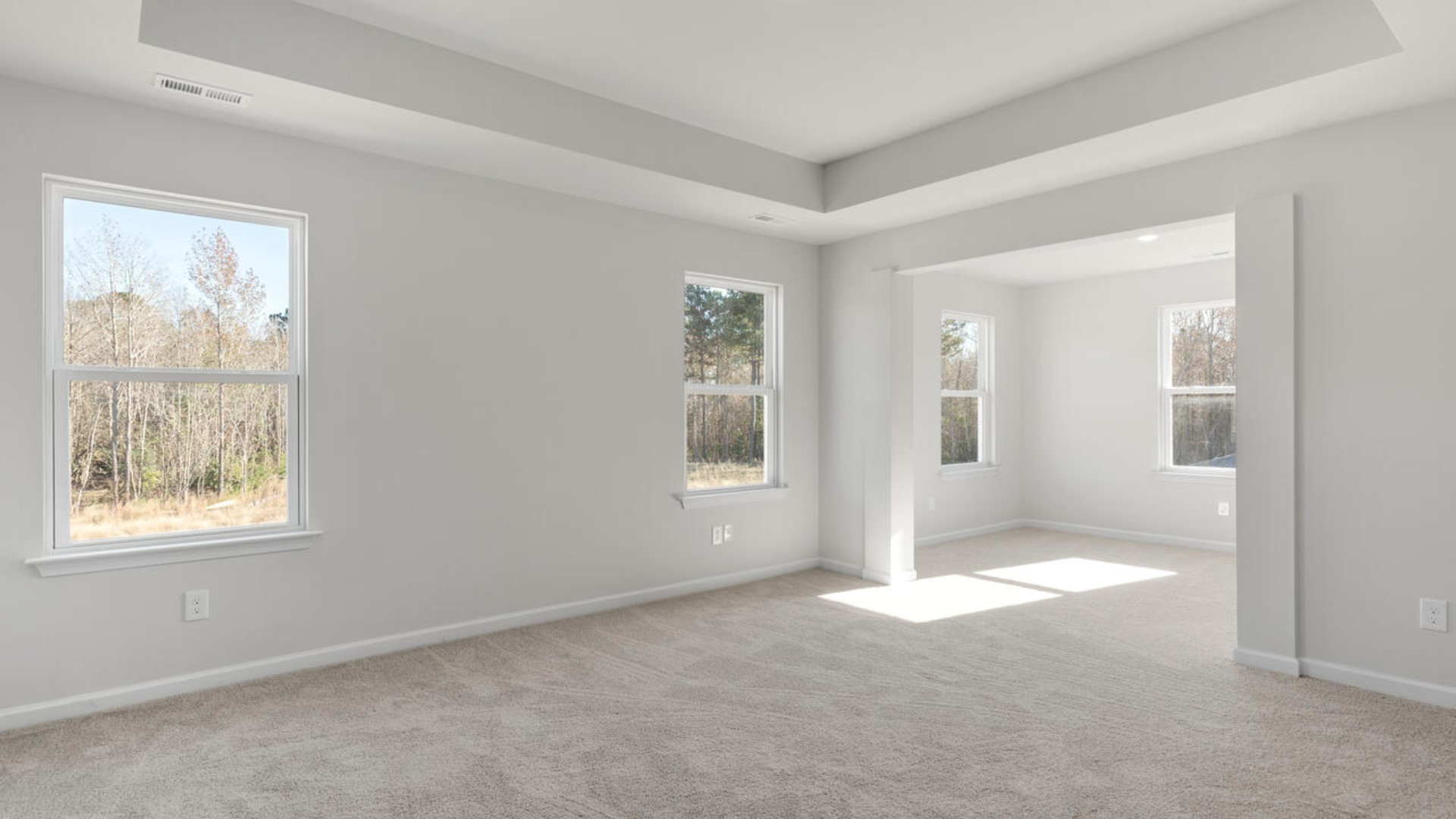 . The large loft in the center of the second floor separates the primary suite from secondary bedrooms and offers endless possibilities—use it as a playroom, media room, or fitness area. The secondary bedrooms are spacious.