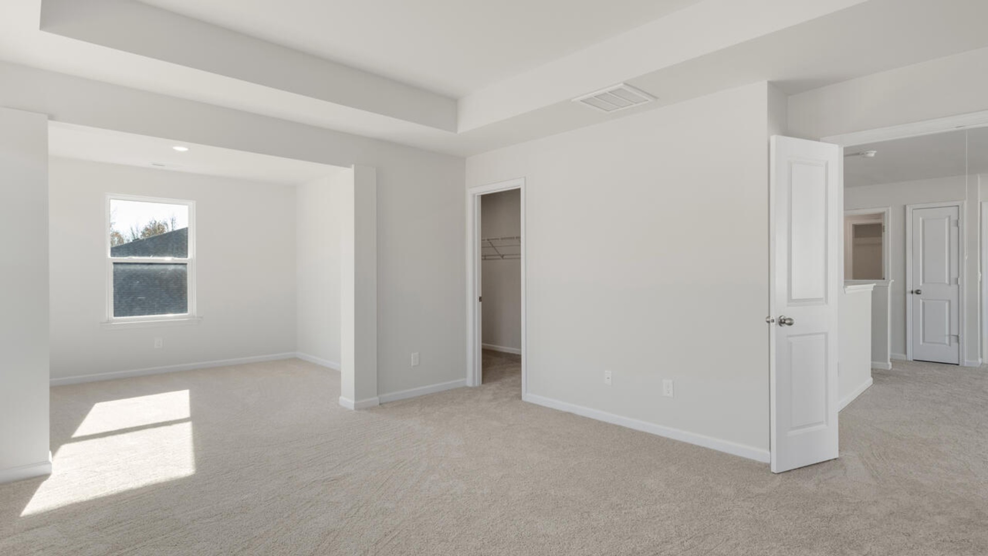 . The large loft in the center of the second floor separates the primary suite from secondary bedrooms and offers endless possibilities—use it as a playroom, media room, or fitness area. The secondary bedrooms are spacious.